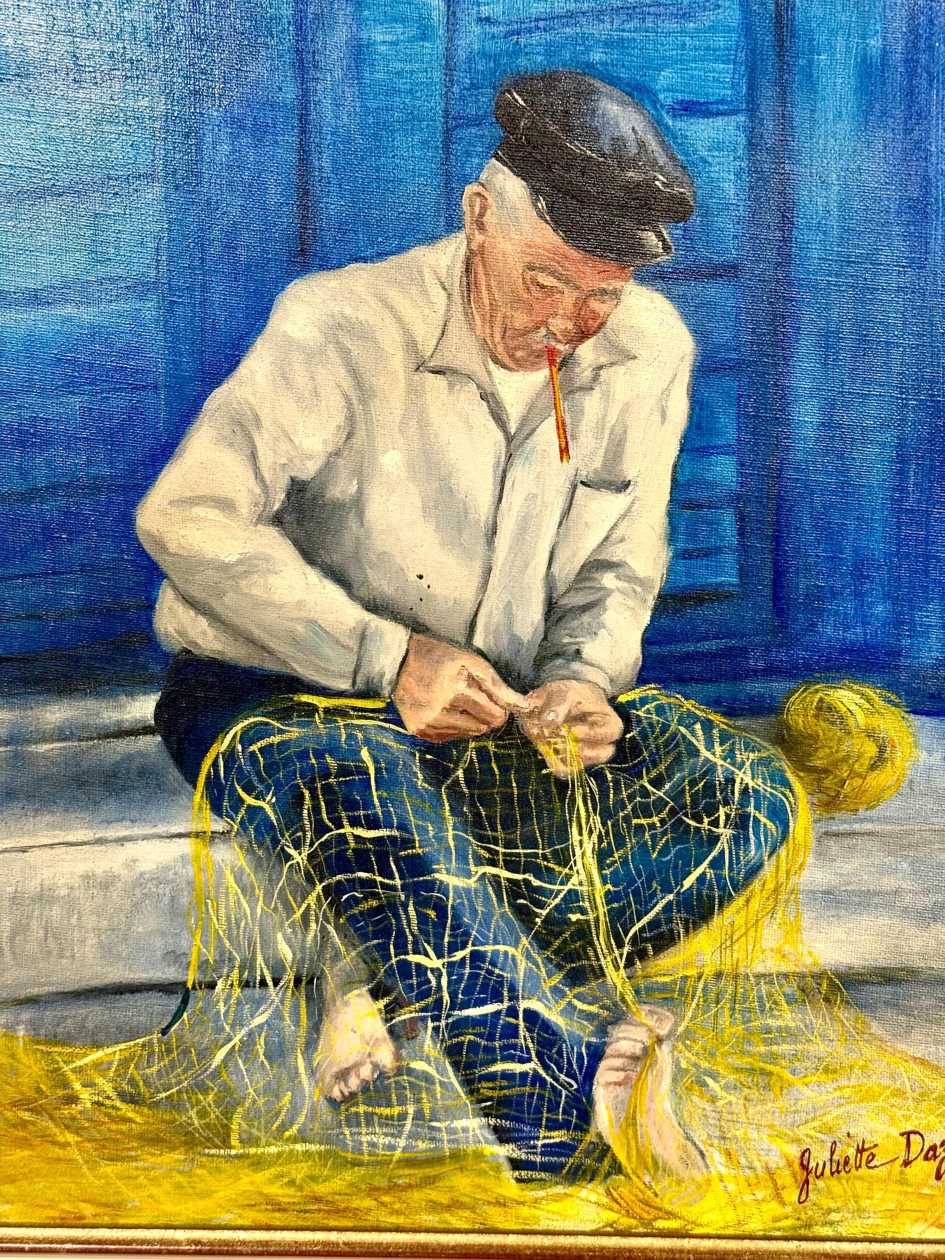 This captivating oil on canvas by French artist Juliette Daziano captures a timeless moment of maritime life with exceptional tenderness and clarity. The scene portrays an elderly fisherman, seated barefoot in front of vivid blue shutters, patiently