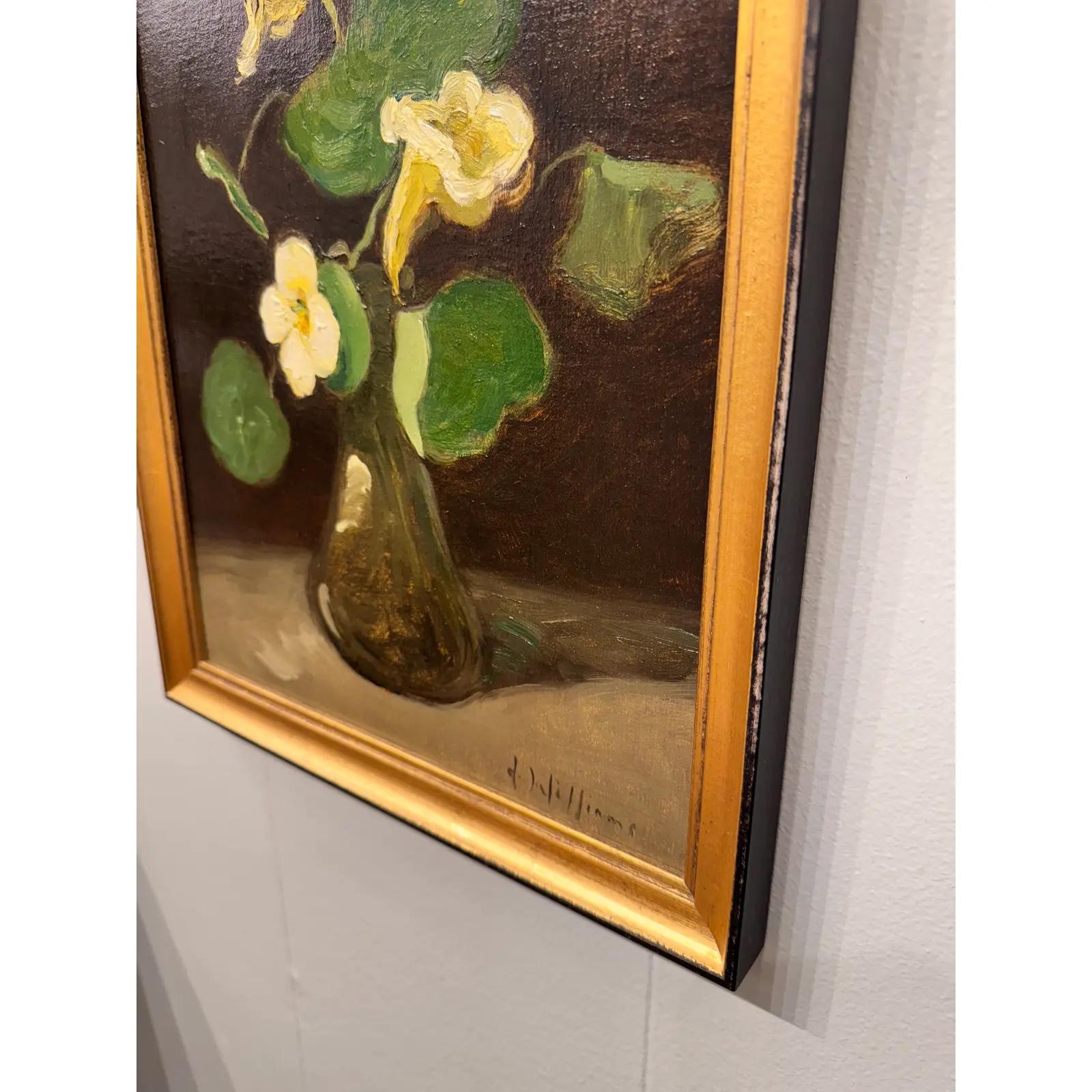 This original oil on canvas is an understated beauty. The yellow horn-shaped nasturtiums pop against the black background, contrasting the green leaves, all held by a dark brown vase. Take home this piece by a local artist for a splash of