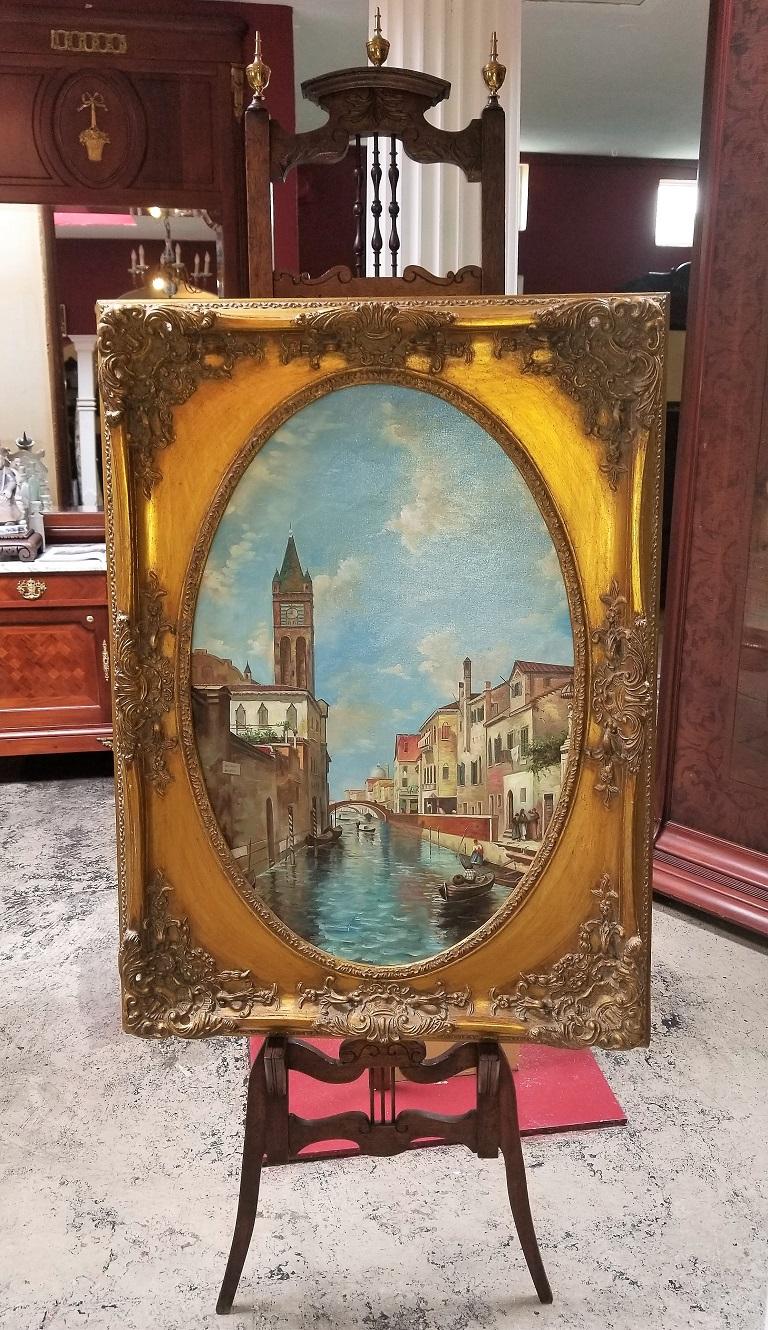 Presenting a striking original oil on canvas of Venetian Scene in Ornate Giltwood Frame.

It is a ‘pity’ that this painting is unsigned. The colors and detail are gorgeous and the STUNNING giltwood frame REALLY displays it beautifully !

The