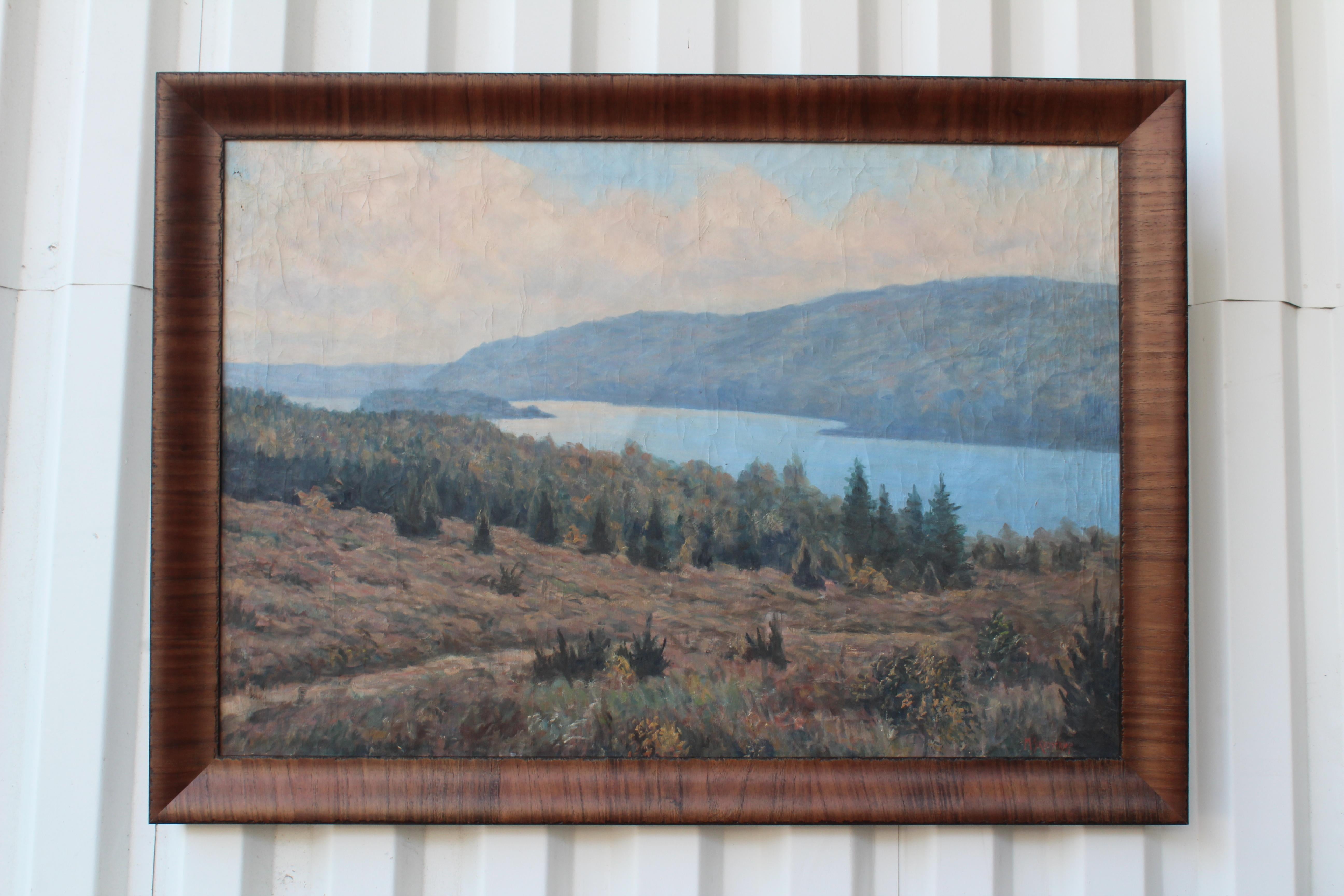 Serene mountain lake scene oil on canvas painting by Canadian artist George Skodstrup. Painted sometime in the 1950s. This painting has been professionally reframed in a beautiful walnut frame with an antique edge detail. Overall this painting is in