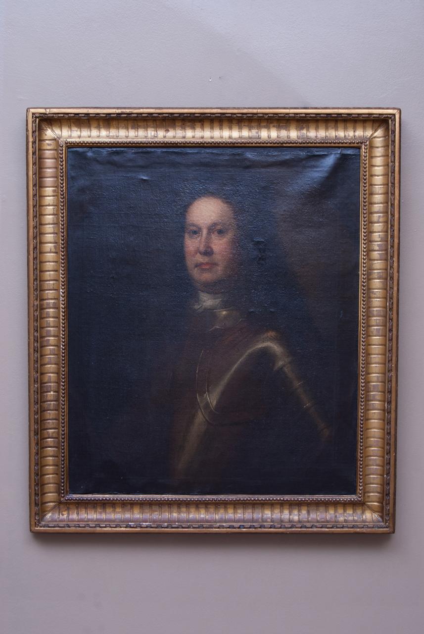 This painting is of a knight in full armour. The hair style indicates the subject was from the late seventeenth century or the early eighteenth century. However, the painting could be an eighteenth century copy of a seventeenth century portrait. The
