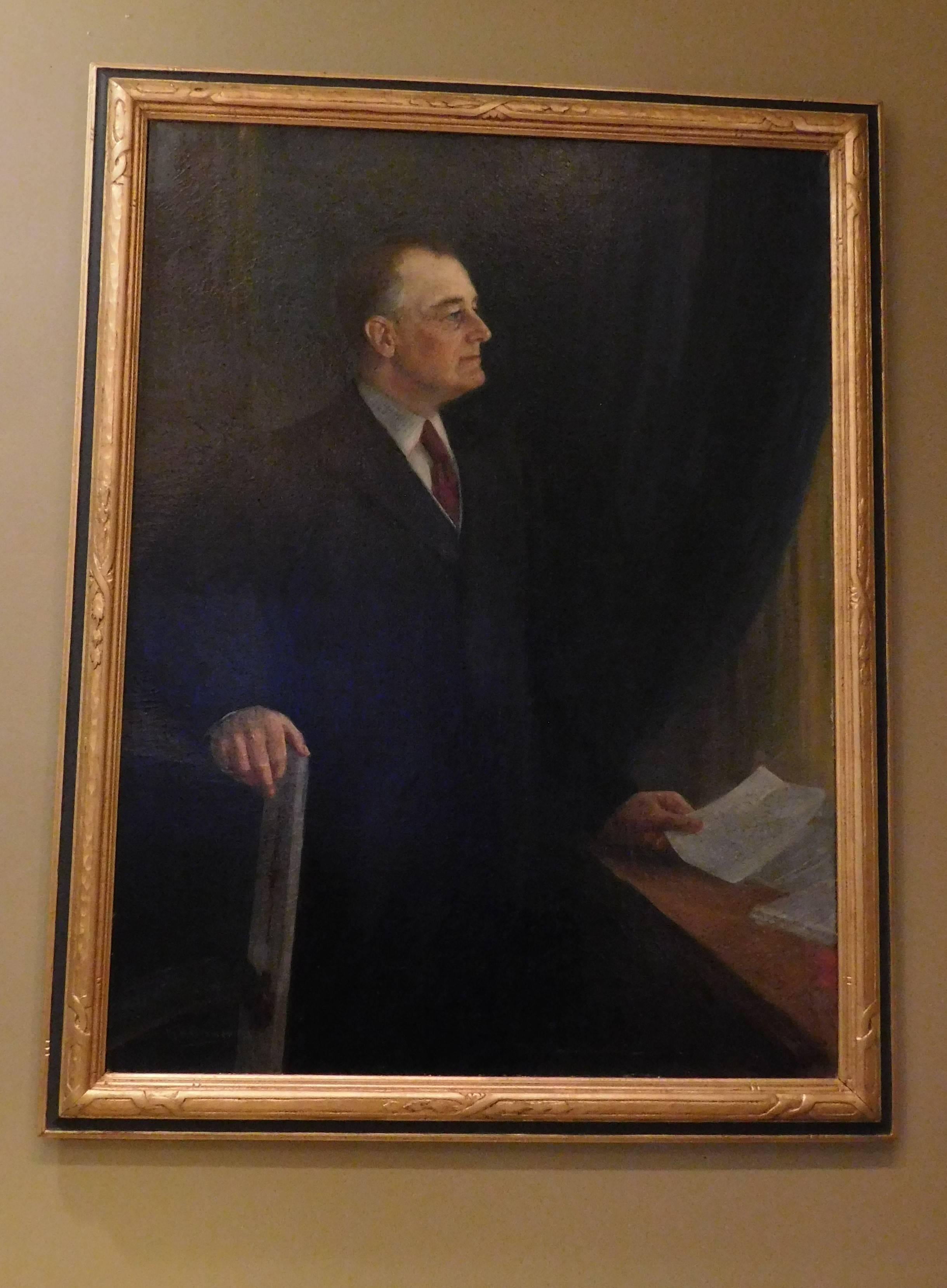 This painting of President Franklin Delano Roosevelt was done in the second year of his presidency. He is shown standing, looking out a window in what appears to be his upstairs office in the White House. Signed lower left corner: N R Brewer 1934.