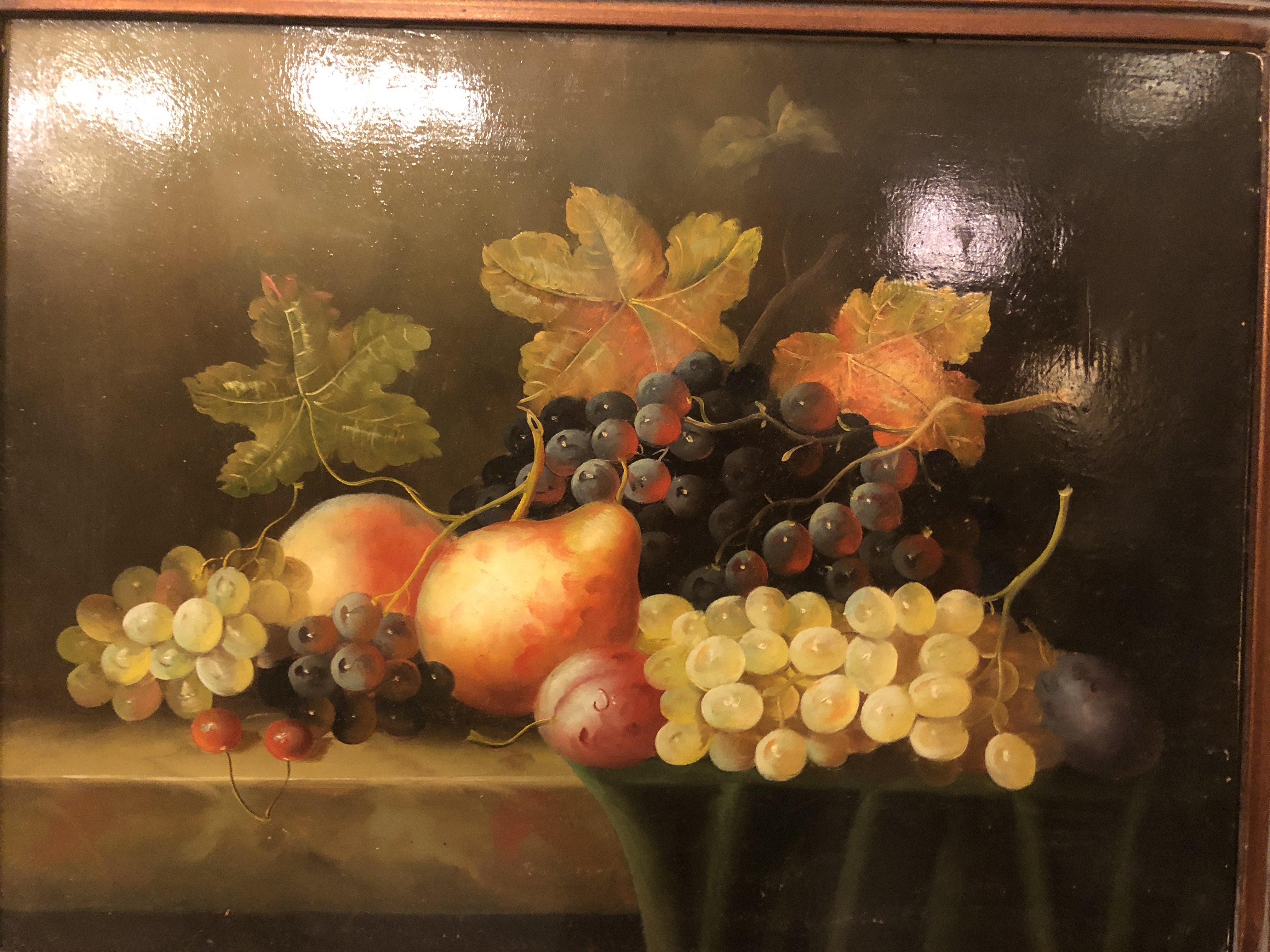 A classic still life fruit oil on panel painting. The painting is framed in a custom hand carved wooden frame. The painting is unsigned.

Dimensions : 23