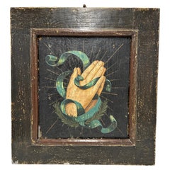 Antique Oil on wood. Italian Late 18th century. Hands in prayer with green ribbon