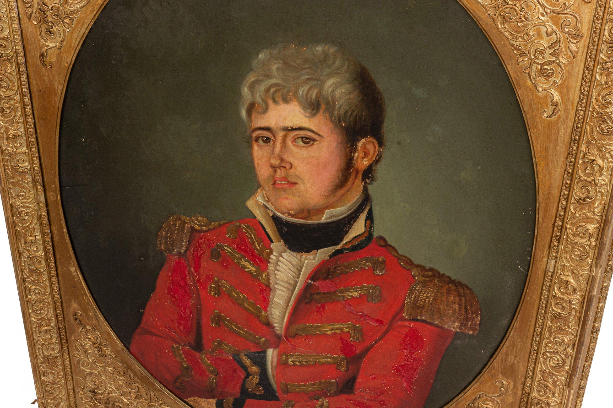 English Georgian (18/19th Cent) oil painting portrait of a young British officer with arms crossed wearing a red coat with gold epaulets in a gilt carved frame.
 