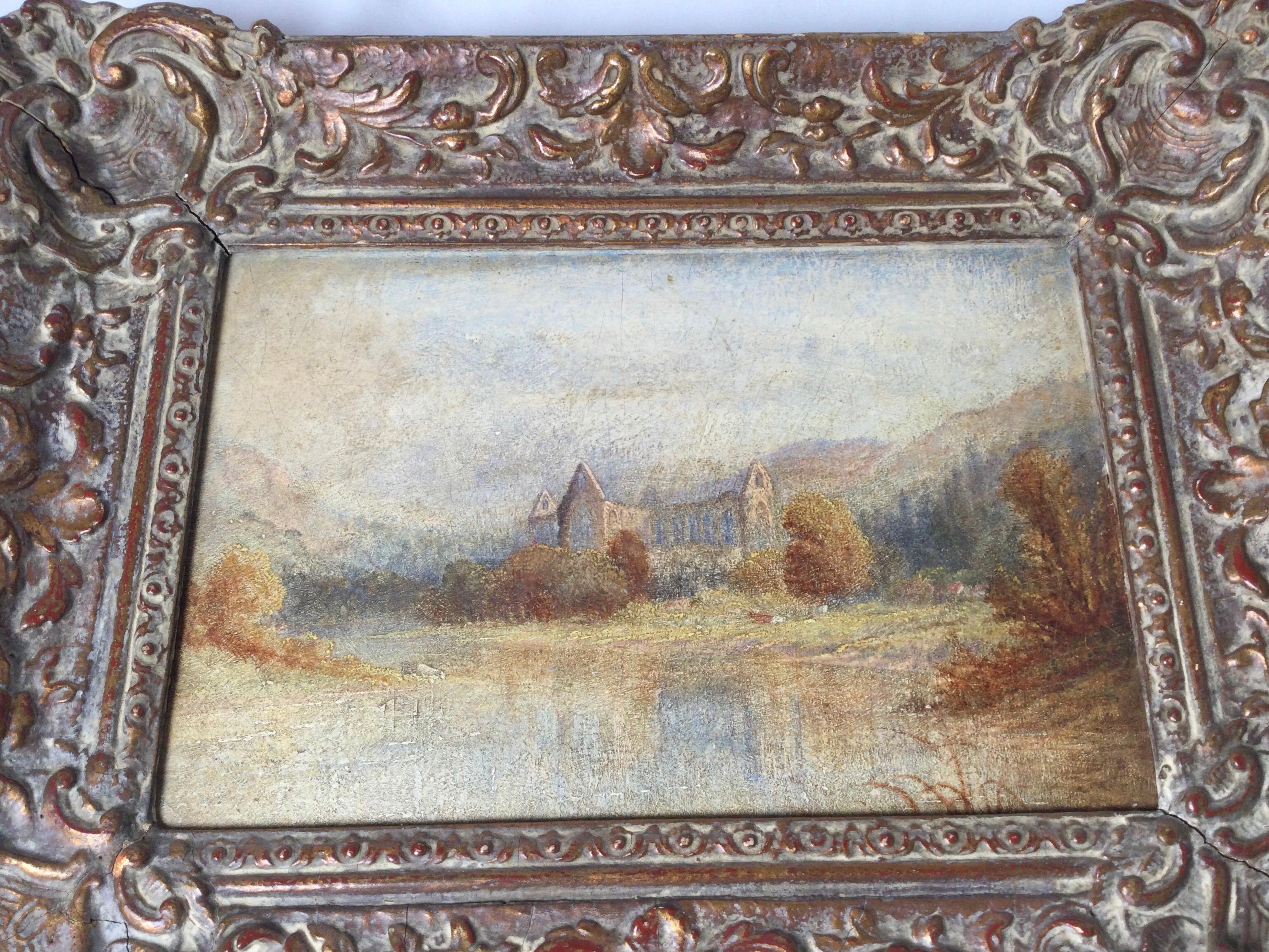 An early 20th century impressionist painting of a European church in early frame. The soft color pallet of the painting pared with the perfect frame of the same time period, probably original.