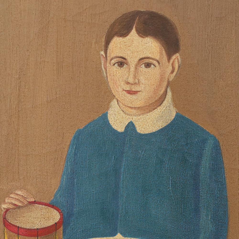 Here we present an intriguing oil painting on canvas of a boy with his dog and drum. Painted in a primitive naive style paying homage to early American portraiture. Presented in a wood frame with information about the artist, Maurice Bodah, on the