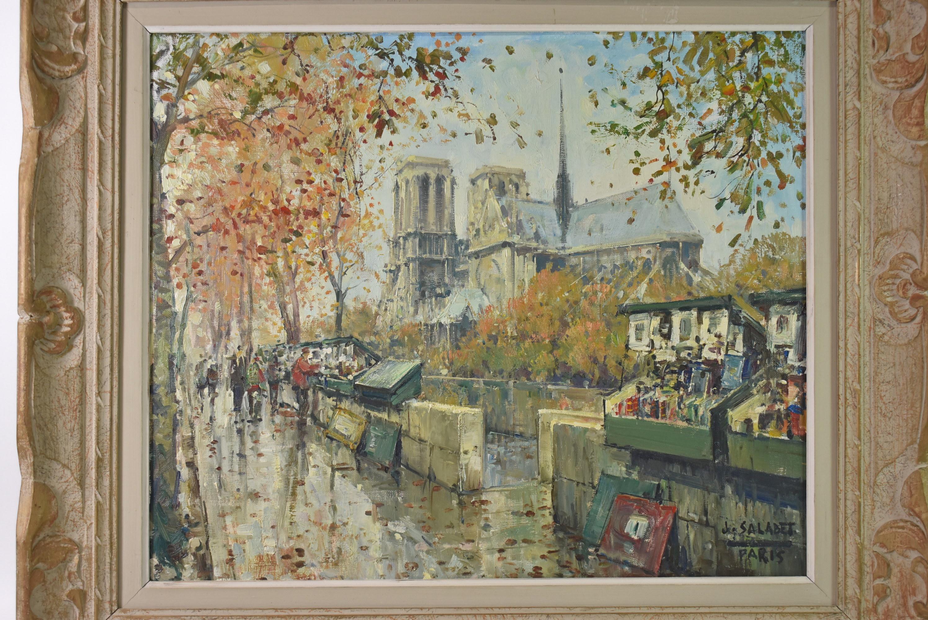 Oil Painting on Canvas of Paris Street Scene of Notre Dame by Jean Salabet. Circa 1950's. Fall scene of a street in Paris with Notre Dame Cathedral in the background and street vendors. Brass label on frame. Artist is Jean Salabet, also known as