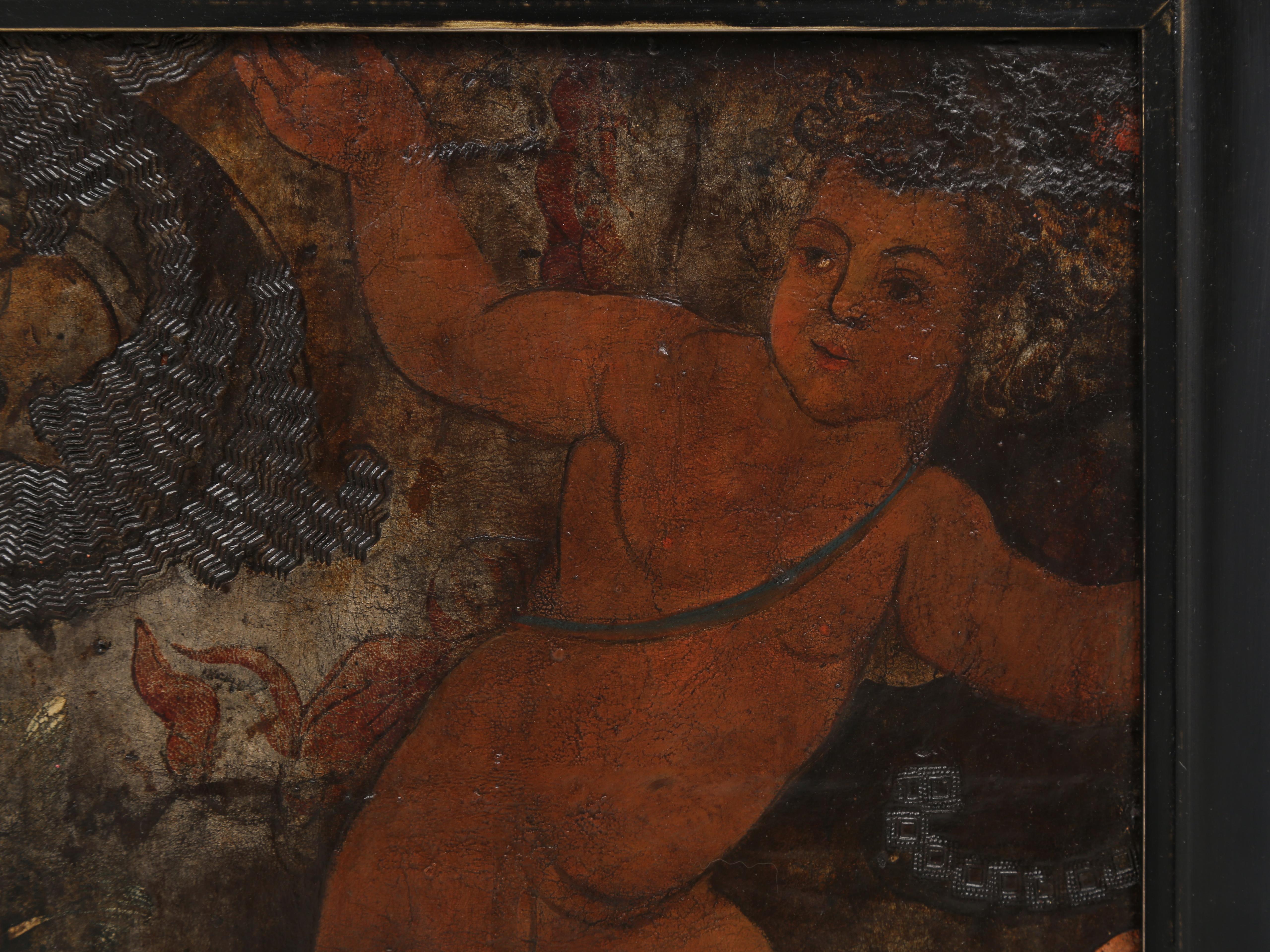 Beautiful 17th century Tooled Leather Oil Painting mounted on board and our best hypothesis is that it is probably Spanish, with a second guess possibly being Dutch. What we do know from a local expert, is that the Putti or Cherub is close to