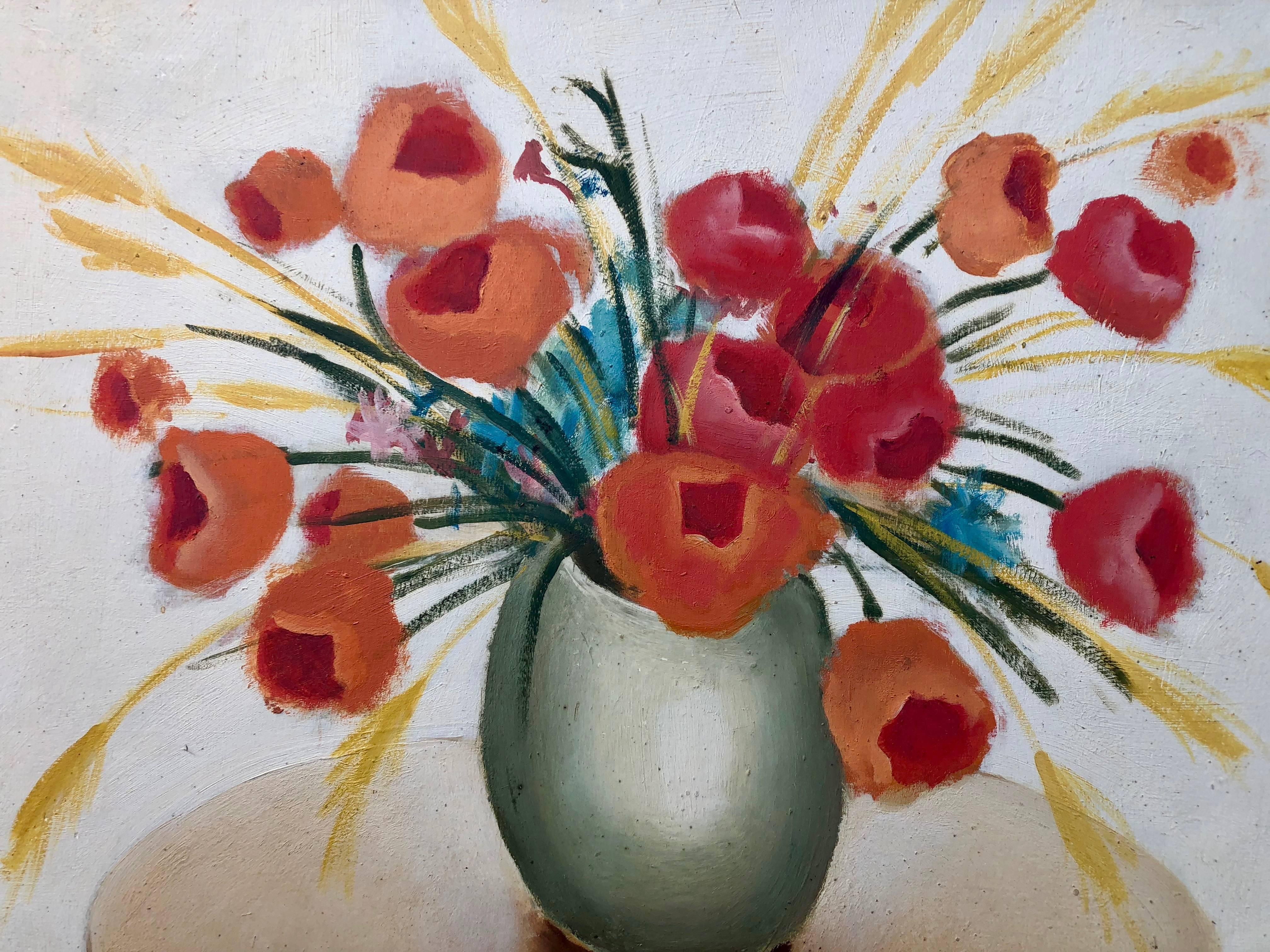 This framed oil painting on wood is by French artist Maurice Esnault (1854-1940) who is known for such still life pieces. This painting is of a vase filled with orange/red flowers sitting on a table and has a cream color background. It is a lovely