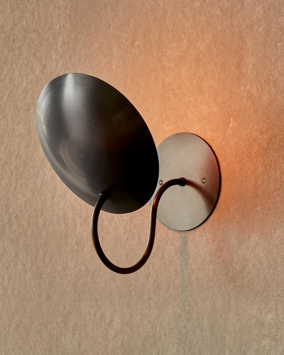The Arlo Sconce features a spun bronze reflector affixed to a curved brass arm, complimenting any space with warmth and subtlety.

OVERALL DIMENSIONS
9
