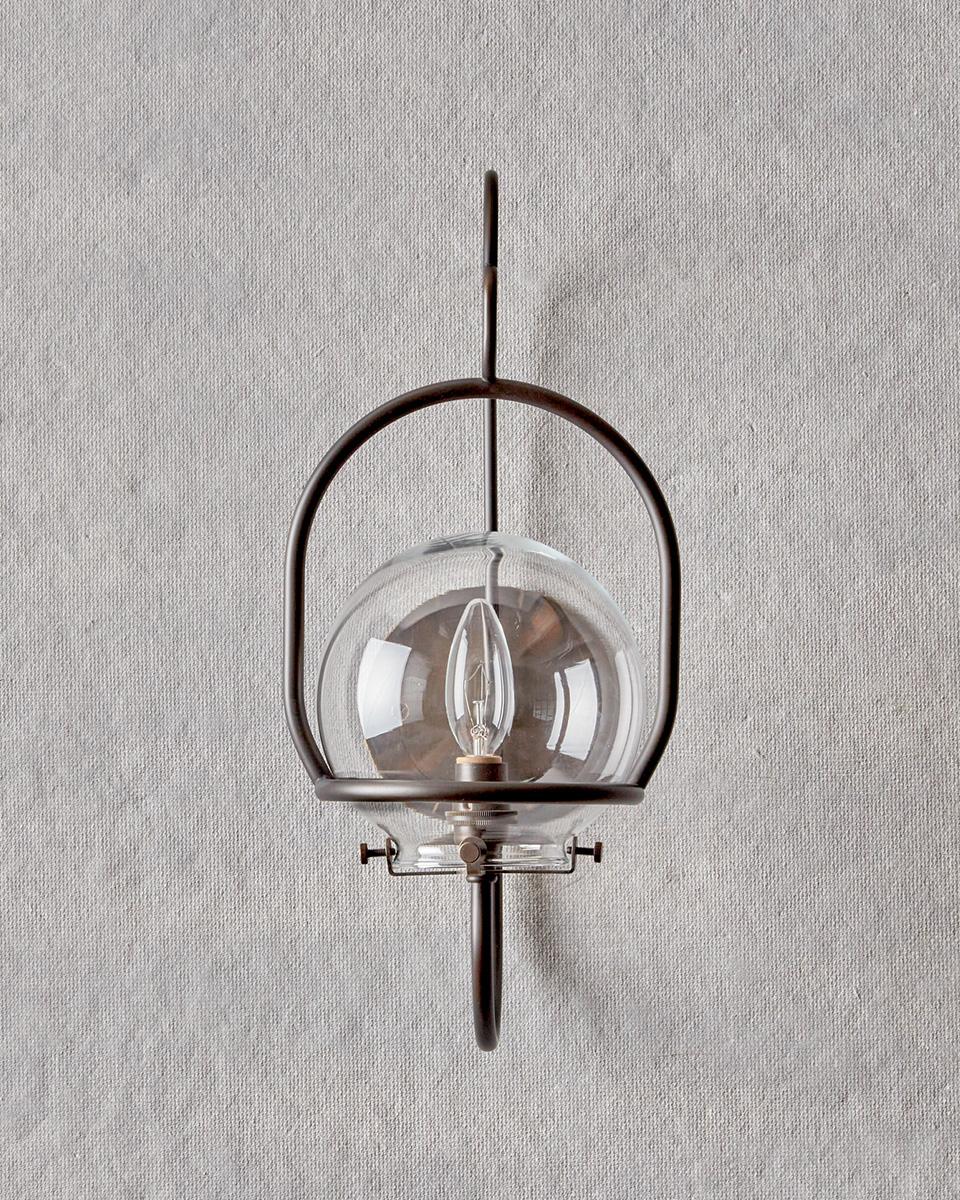 The scaled-down version of our Emil Wall Lantern provides versatility both indoors and out. Clean bent brass lines update this classic lantern with a nod to tradition.

OVERALL DIMENSIONS
7.25