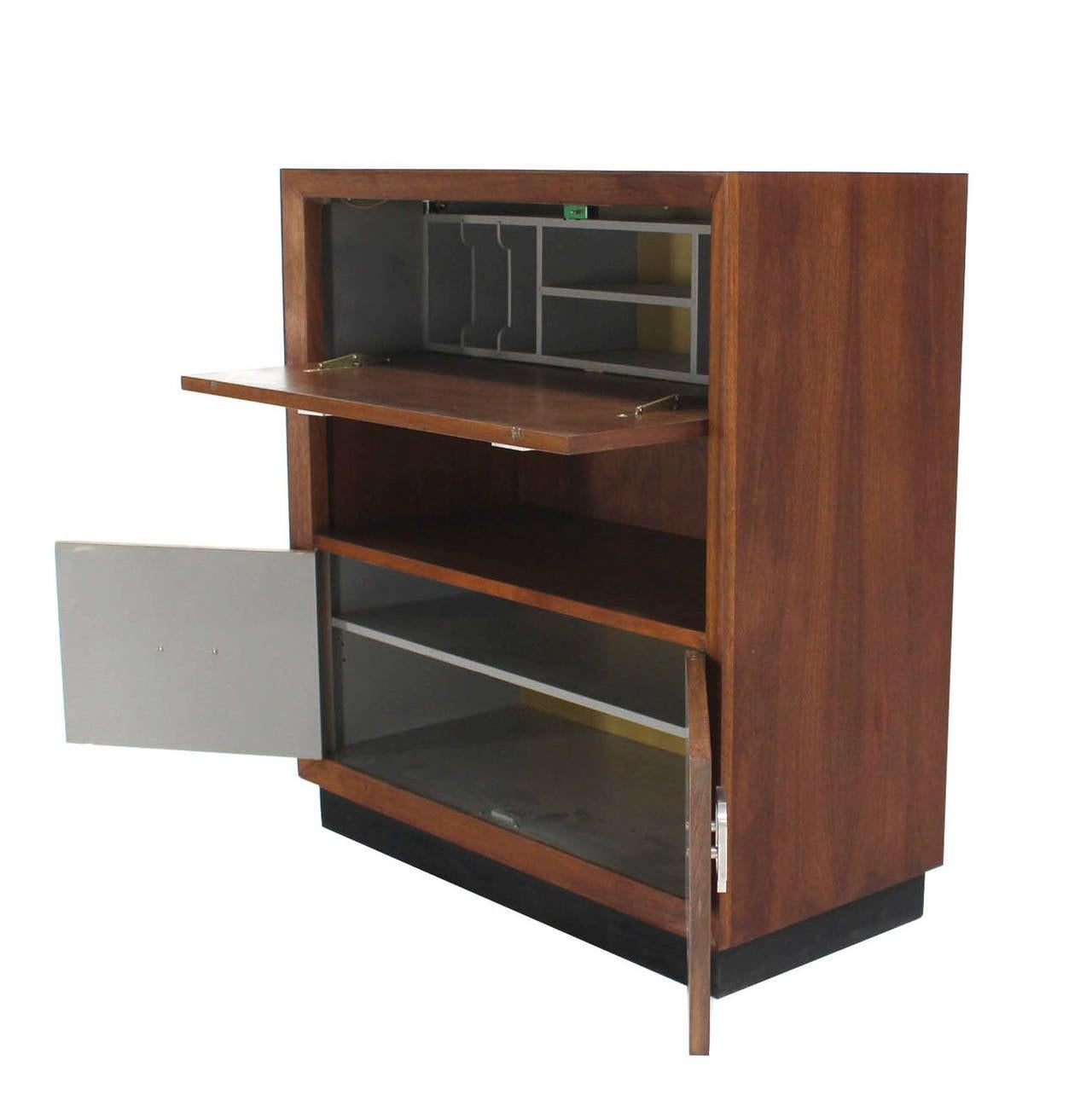 Square shape lines Mid Century Danish modern drop down front secretary desk console table with large Art Deco style Pulls and storage cabinet on the bottom.