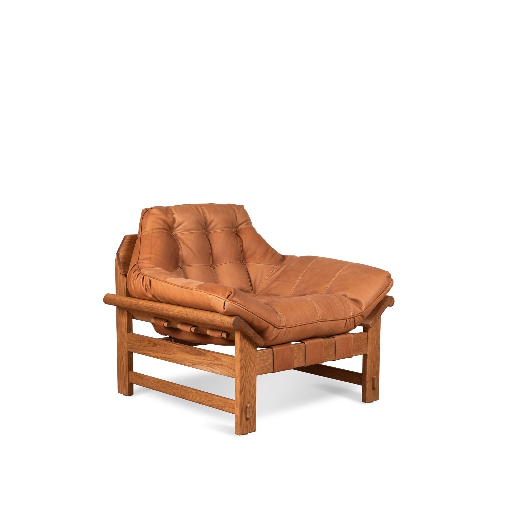 The Ojai lounge chair features a solid white oak or solid walnut base and a single tufted leather cushion with leather straps. Shown here in deer tan leather and oiled oak.

The Lawson-Fenning Collection is designed and handmade in Los Angeles,