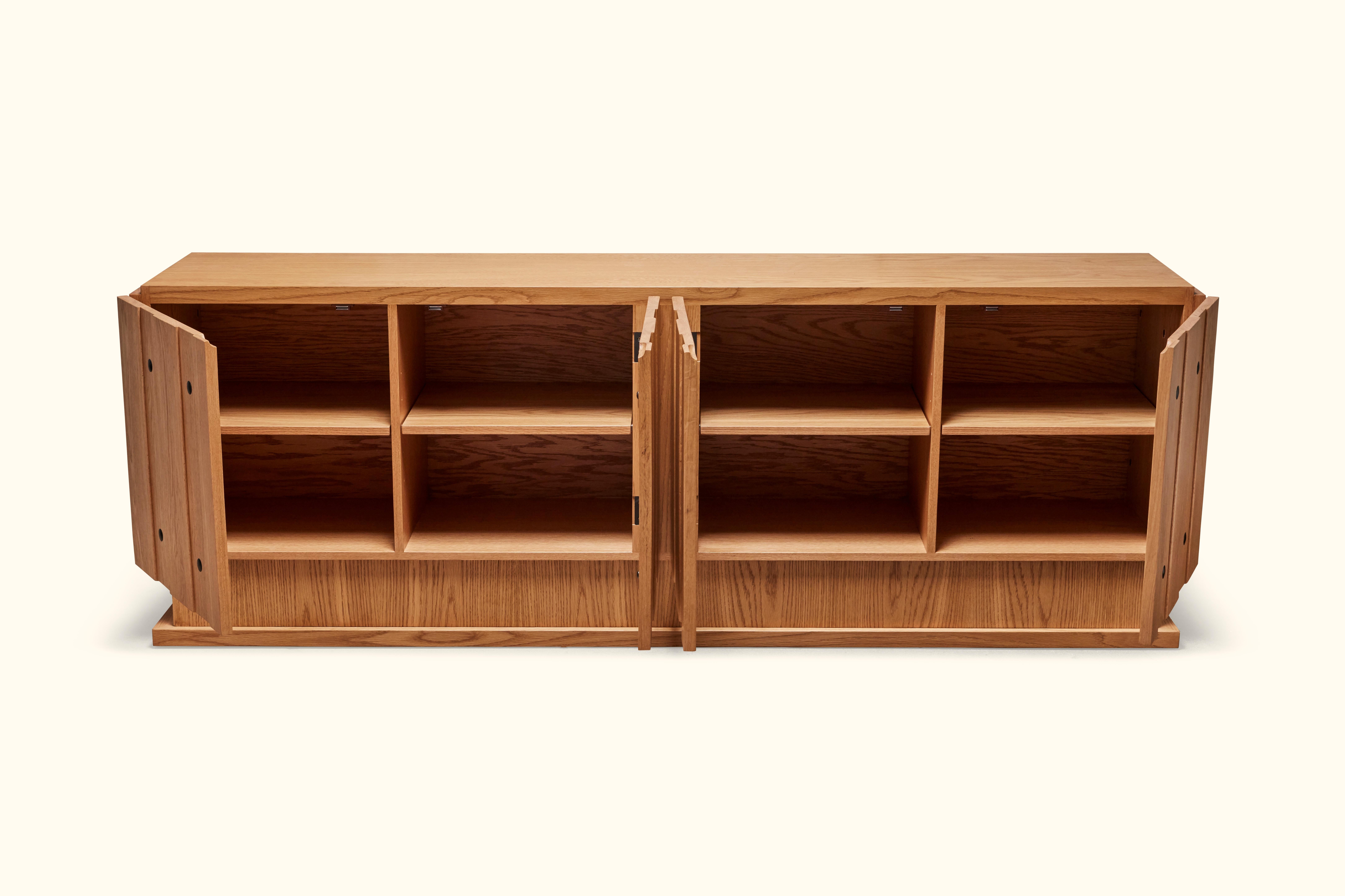 The 4-door Ojai cabinet features board and batten doors with iron details and adjustable shelves. Available in two sizes and in American walnut and white oak. Shown here in Oiled Oak. 

The Lawson-Fenning Collection is designed and handmade in Los