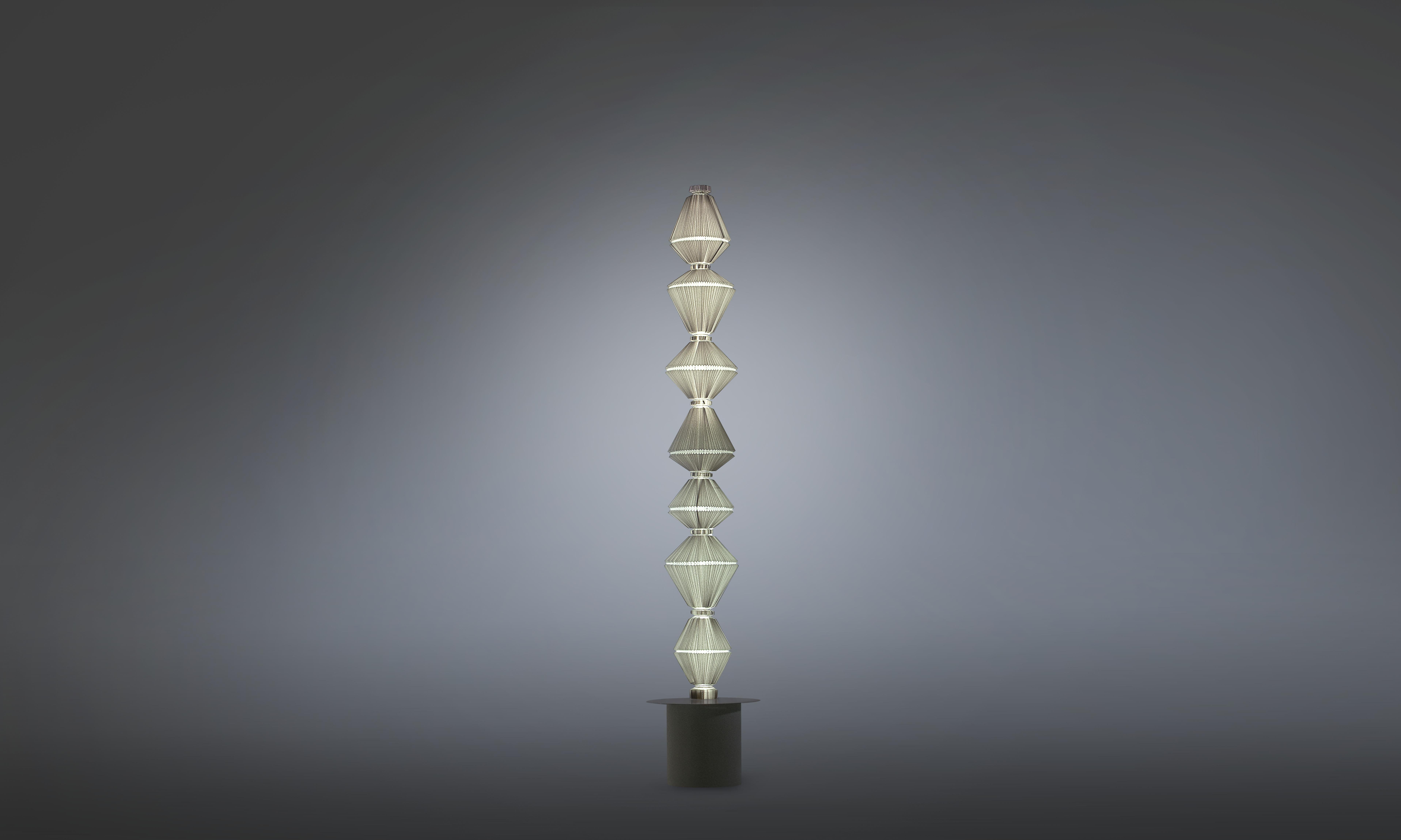 OÏPHORIQUE P GR
Floor lamp. Steel structure. Black lacquered canopy and black chrome trim disc. Light grey textil diffuser or dark grey fire resistant textil diffuser. By Atelier Oï, 2014

Manufactured by Parachilna.


Oïphorique displays an elegant
