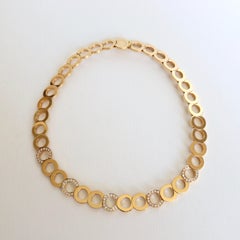 O.J. Perrin Set of a Necklace and Earrings in 18 Carat Gold and Diamonds