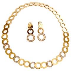 O.J. Perrin Set of a Necklace and Earrings in 18 Carat Gold and Diamonds
