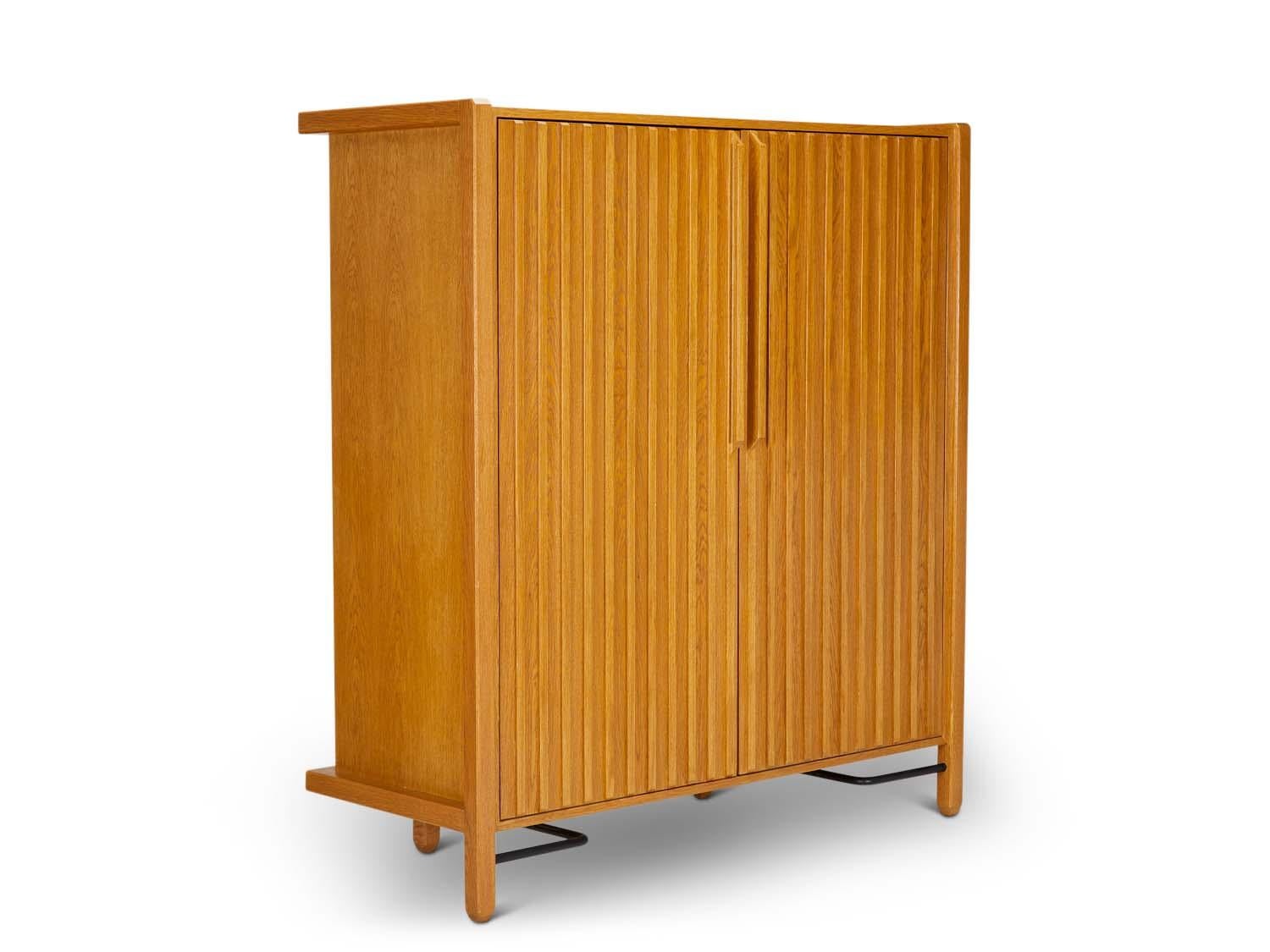 The Ojai Tall Cabinet has 2 doors, open storage and four drawers. It has solid white oak or American walnut legs and case, and features a metal stretcher on the base.

 The Lawson-Fenning Collection is designed and handmade in Los Angeles,
