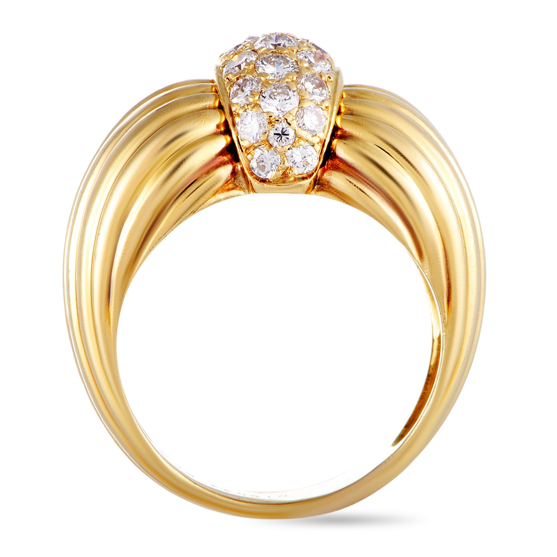 This O.J. Perrin ring is made out of 18K yellow gold and diamonds and weighs 11.7 grams. The diamonds feature grade F color and VS1 clarity and amount to 0.65 carats. The ring boasts band thickness of 6 mm and top height of 7 mm, while top