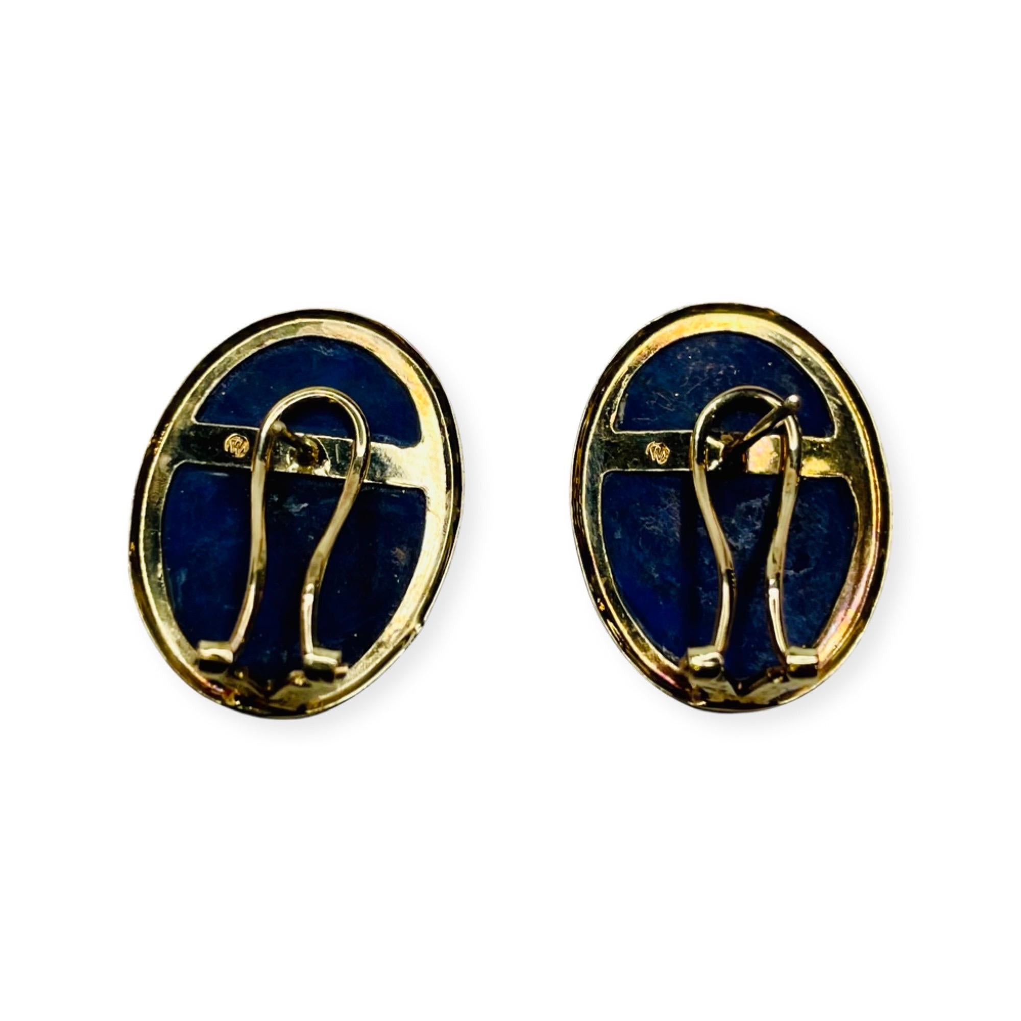 Okada 14K Yellow Gold Natural Lapis Earrings. There are 2 - 18.0 mm x 13.0 mm natural Lapis cabochons, bezel set.The earrings have omega backs. 
400-70-348