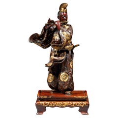 Okimono en bronze représentant Fujiwara no Yasumasa signé Miyao