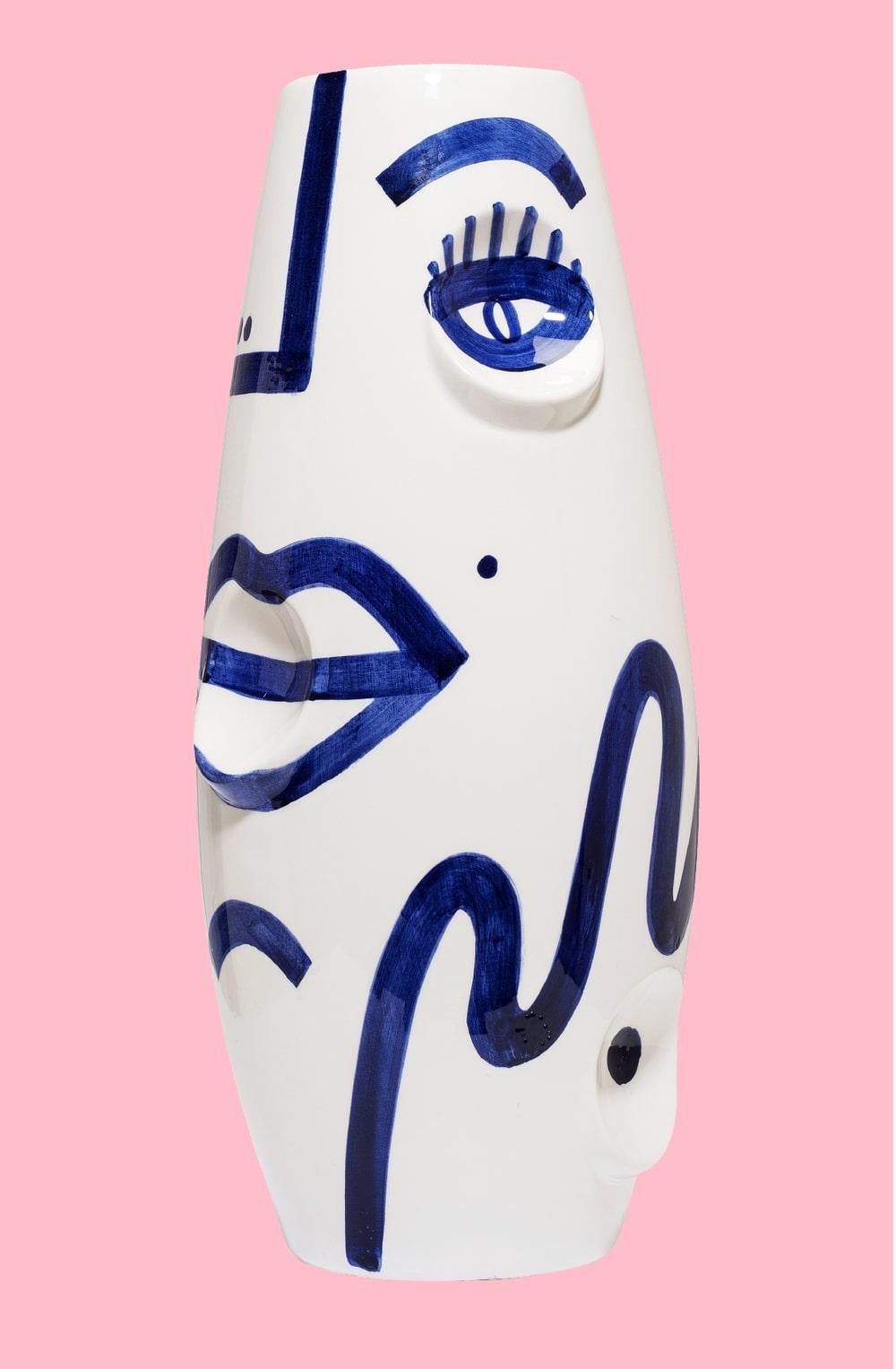 OKO face ceramic vase by Malwina Konopacka
Materials: Ceramic
Dimensions: ø 19 x 42 cm

It was first presented in 2014 as part of Tokyo Designers Week and has since had numerous re-editions and collection launches, all decorated and hand-painted