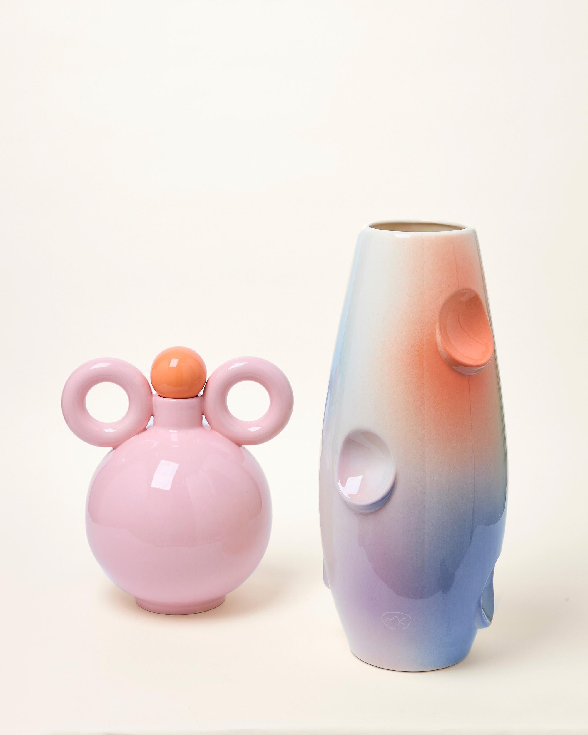 OKO Vase is the most famous design by Malwina Konopacka. Its name comes from the oval recesses in the body of the vase, which give the object a spatial character and make it function as a standalone sculpture when there are no flowers in it.

The