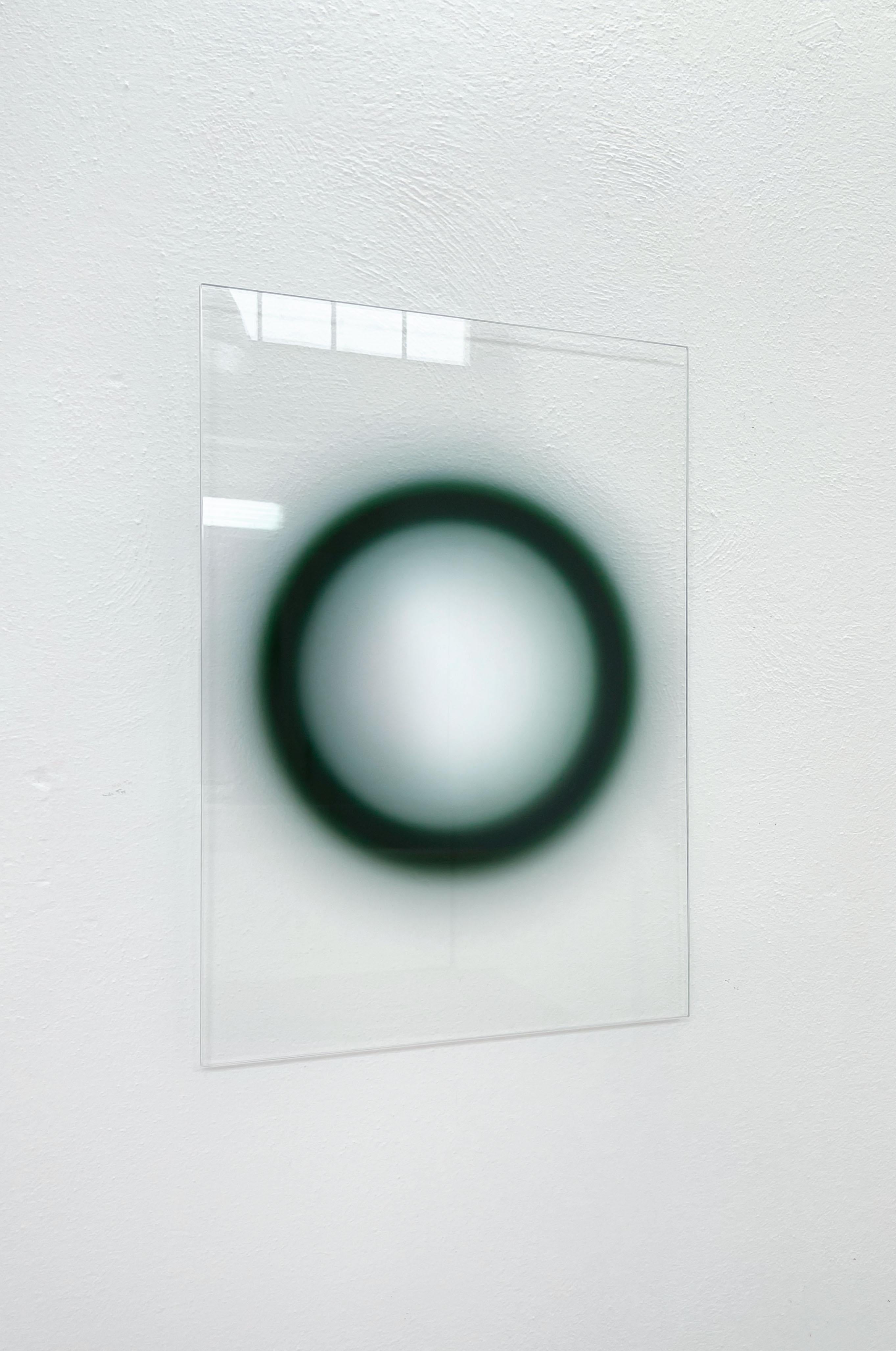 Ol reverse by Celo.1
Dimensions: D 50 x 70 cm
Materials: metal, laminated glass mirror.

Inevitable Future
The mirror is composed by three areas: an outer ring which reflects its surrounding, an inner, dark-shaded ring which engulfs anything