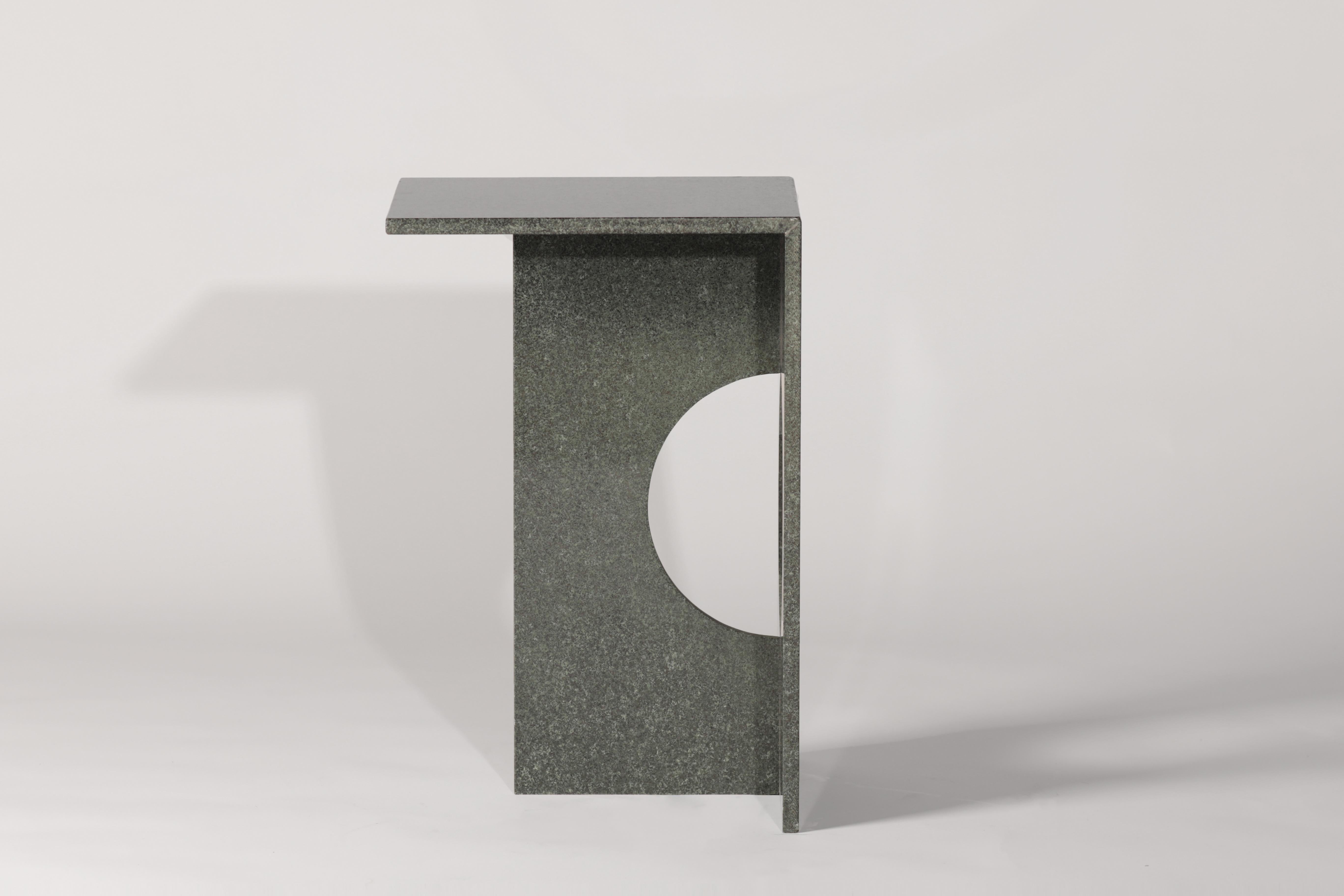 A side table made entirely from natural diabase stone makes this piece like a modern sculpture. Ola side table can be made from green diabase stone or diffferent marbles if required. Perfection of machine cut blends with handmade touches at the