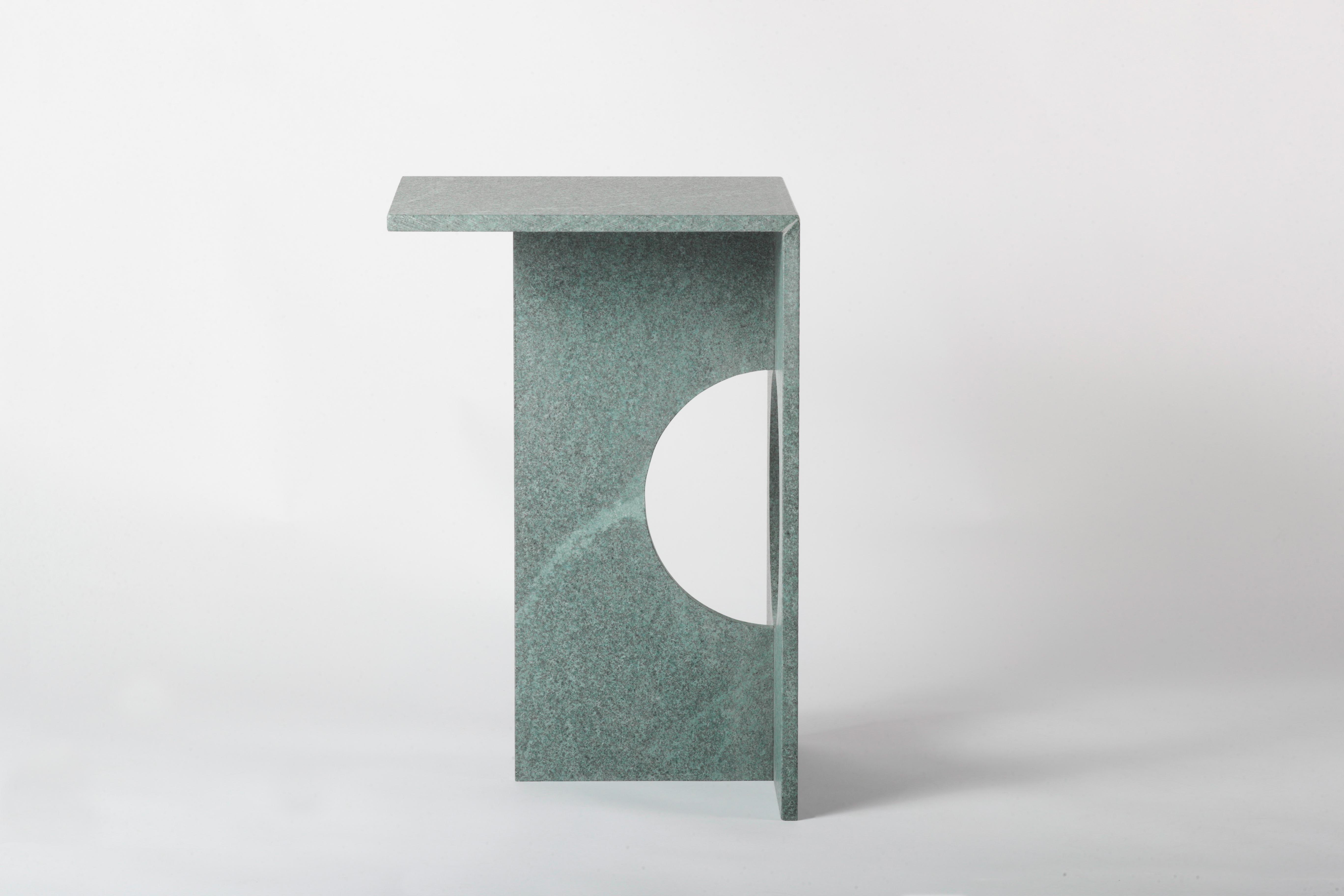 A side table made entirely from natural diabase stone makes this piece like a modern sculpture. Ola side table can be made from green diabase stone or diffferent marbles if required. Perfection of machine cut blends with handmade touches at the