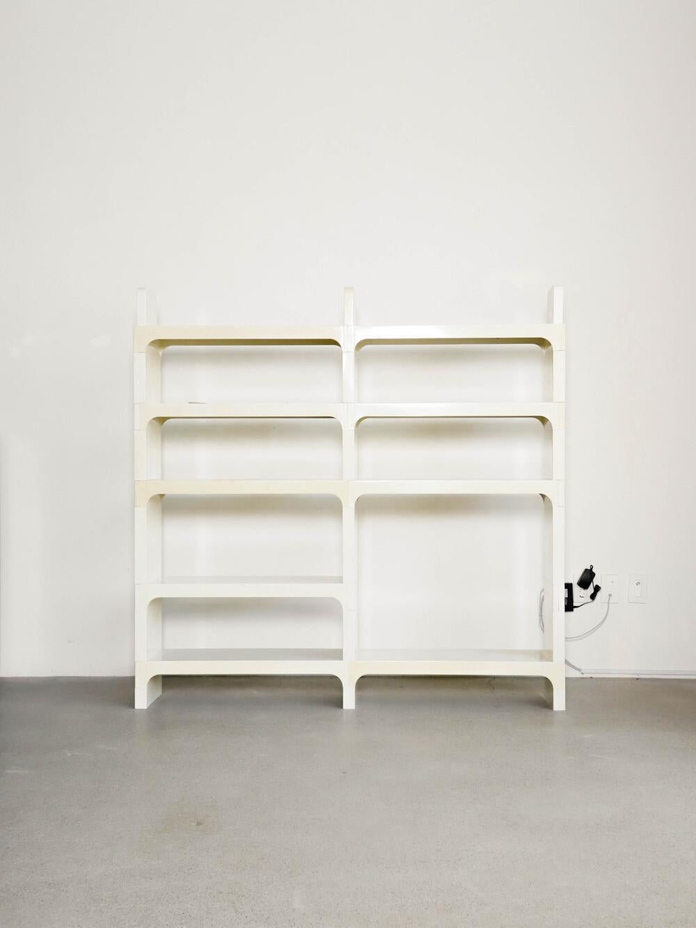 This rare example of spaceage bookshelf can be pushed up against the wall or used as a room divider.  

Made of high quality ABS plastic, this can be disassembled and used in various forms.  