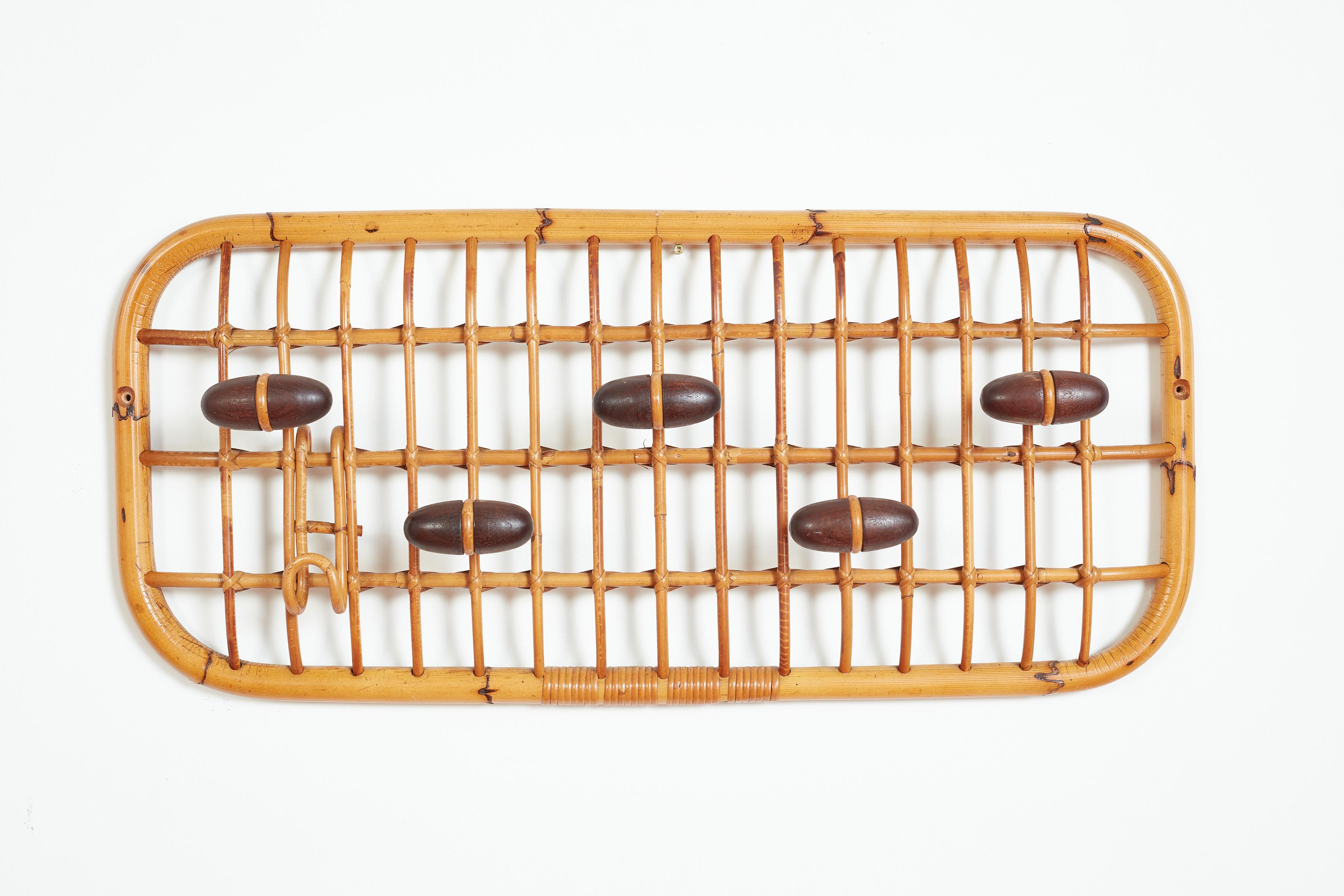 Olaf von Bohr for Bonacina coat rack Italy, circa 1960's  
Bamboo and rattan coat rack  
Five wooden coat hangers and one molded bamboo hook
