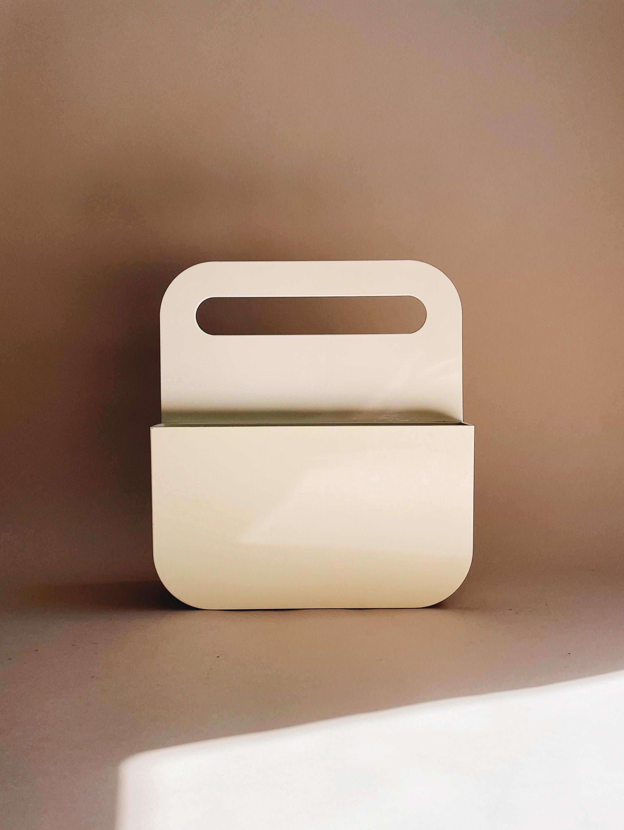 Olaf Von Bohr

Ivory plastic magazine rack, designed by Olaf Von Bohr for Kartell.

Measures 12” tall, 10.75” wide and 3.5” deep.