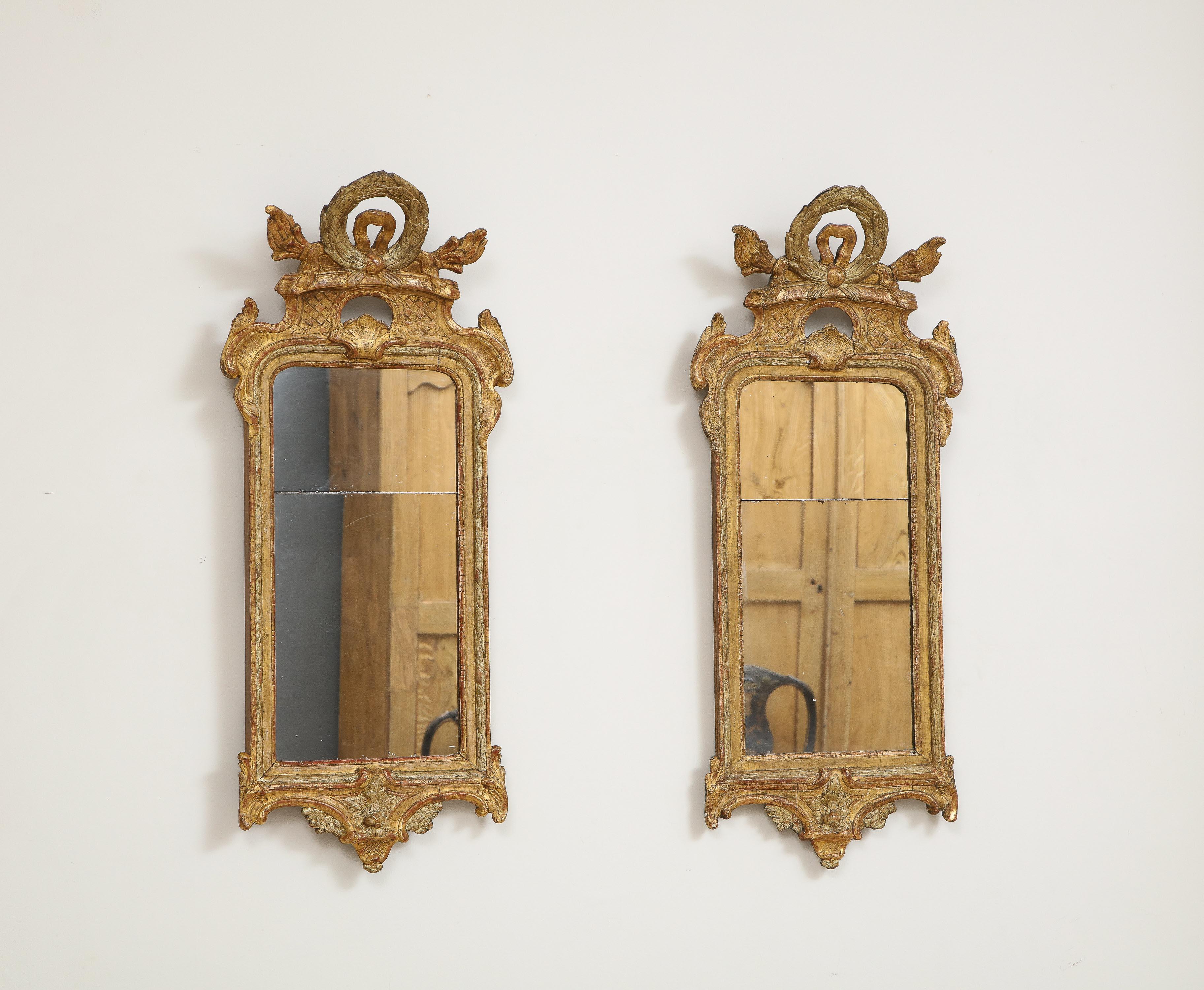 Olaf Wetterberg (1745 Sweden 1803), Rococo mirrors, pair, circa 1760, giltwood with original plates.

A peculiarity of Swedish mirrors, well into the 19th century, is that in all but the grandest contexts they are made in two parts. This was not due