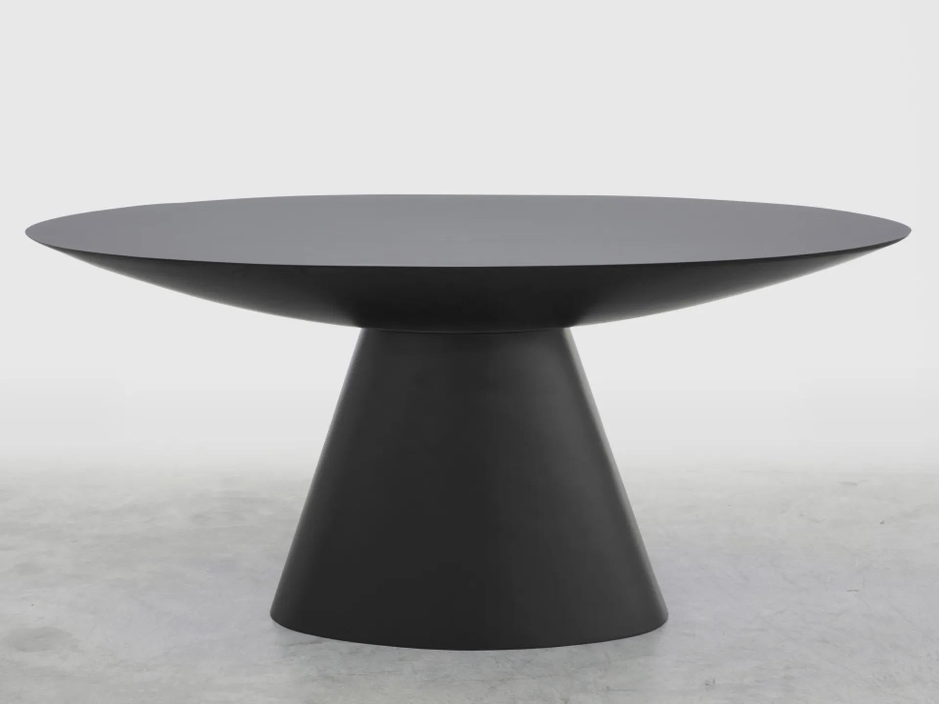 Slab coffee table by Imperfettolab
2020
Dimensions: 179 x 99 x H 74
Materials: Fibreglass
Available in black and white.

Pure geometry for this table that reveals an oval-shaped top. A spacious ellipse raised from a central base, for a