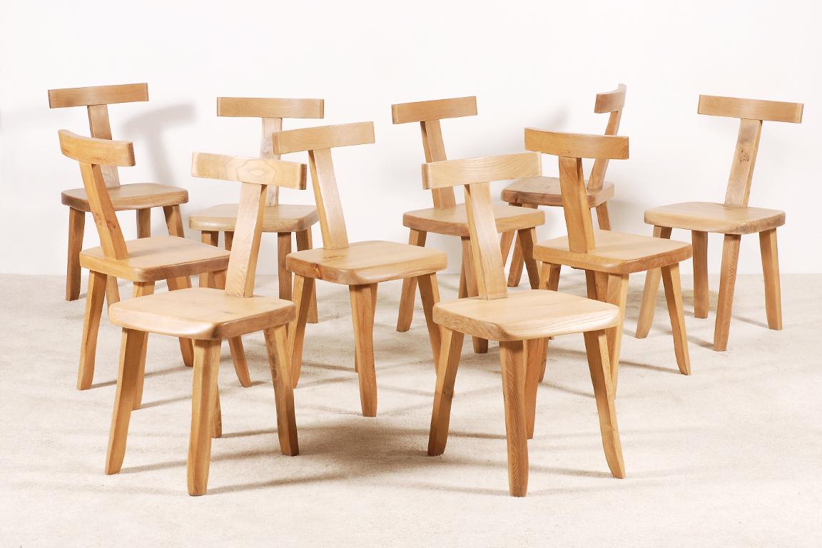 Set of 10 chairs designed by Olavi Hanninen and manufactured by Mikko Nupponen. 
These chairs are made of stained elm wood and sculpturally crafted by hand.  
Very minimalistic, yet brutalistic shaped and in excellent original condition.