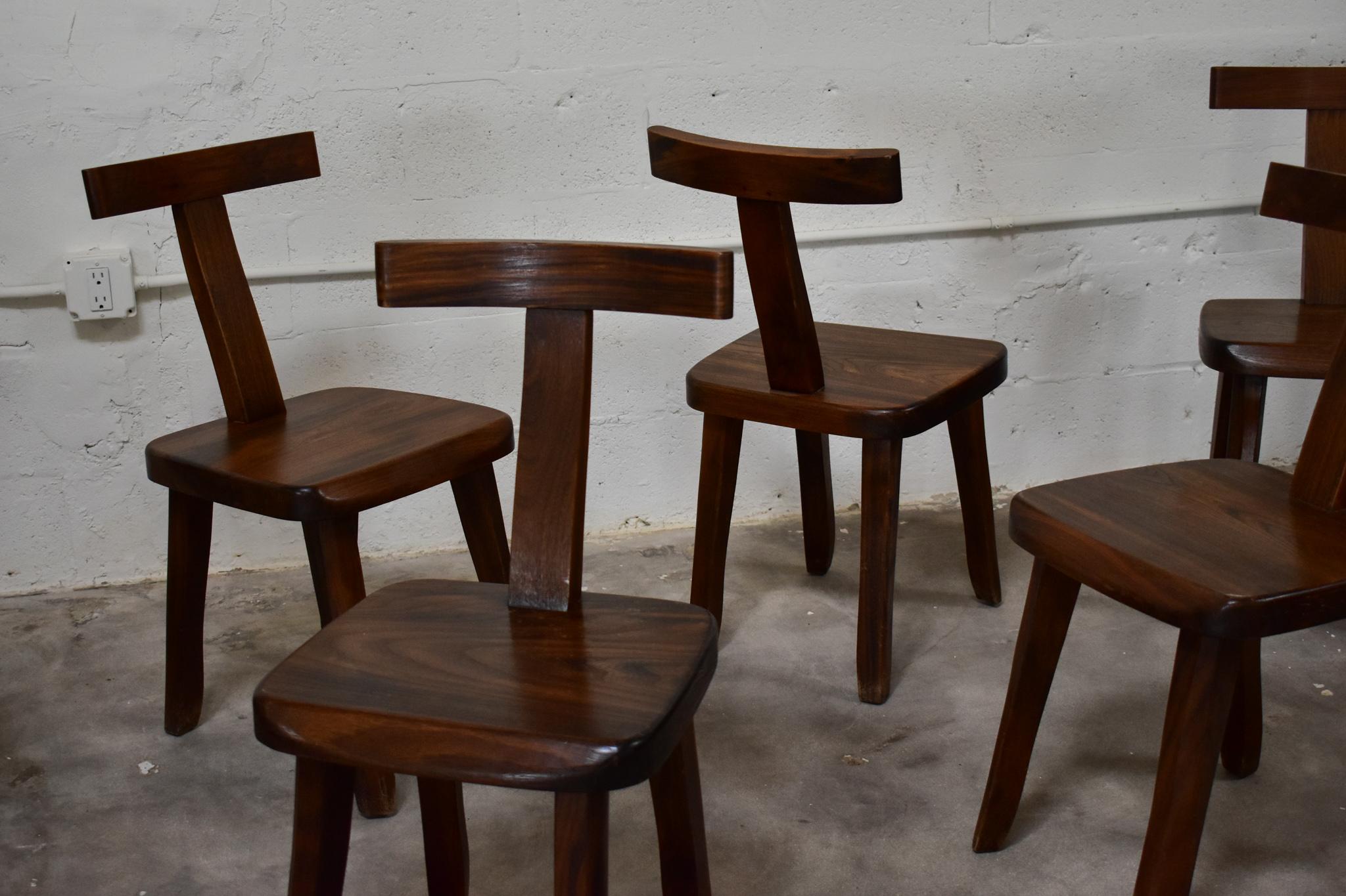 These brutalist dining chairs were designed by olavi hanninen . The freeform design of these elm chairs embodies the nature of brustalism and its appeal to the imperfect handmade item . Although brutalism is known to be harsh , the texture and