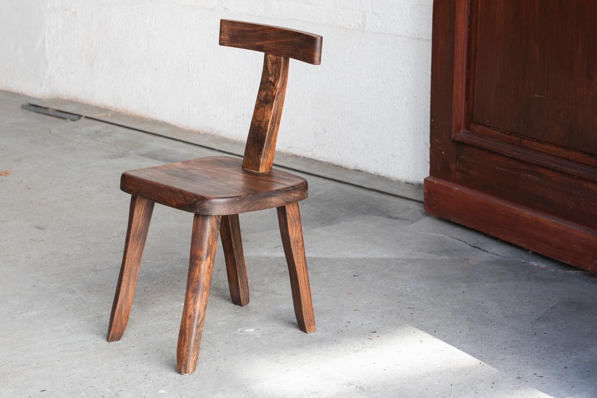 Side chair designed by Olavi Hanninen in Finland around 1960. Well-known T-shaped solid wooden chair. It had a professional repair on the backrest.

H: 81 cm
W: 40 cm
D: 39 cm
Seat height: 34 cm

