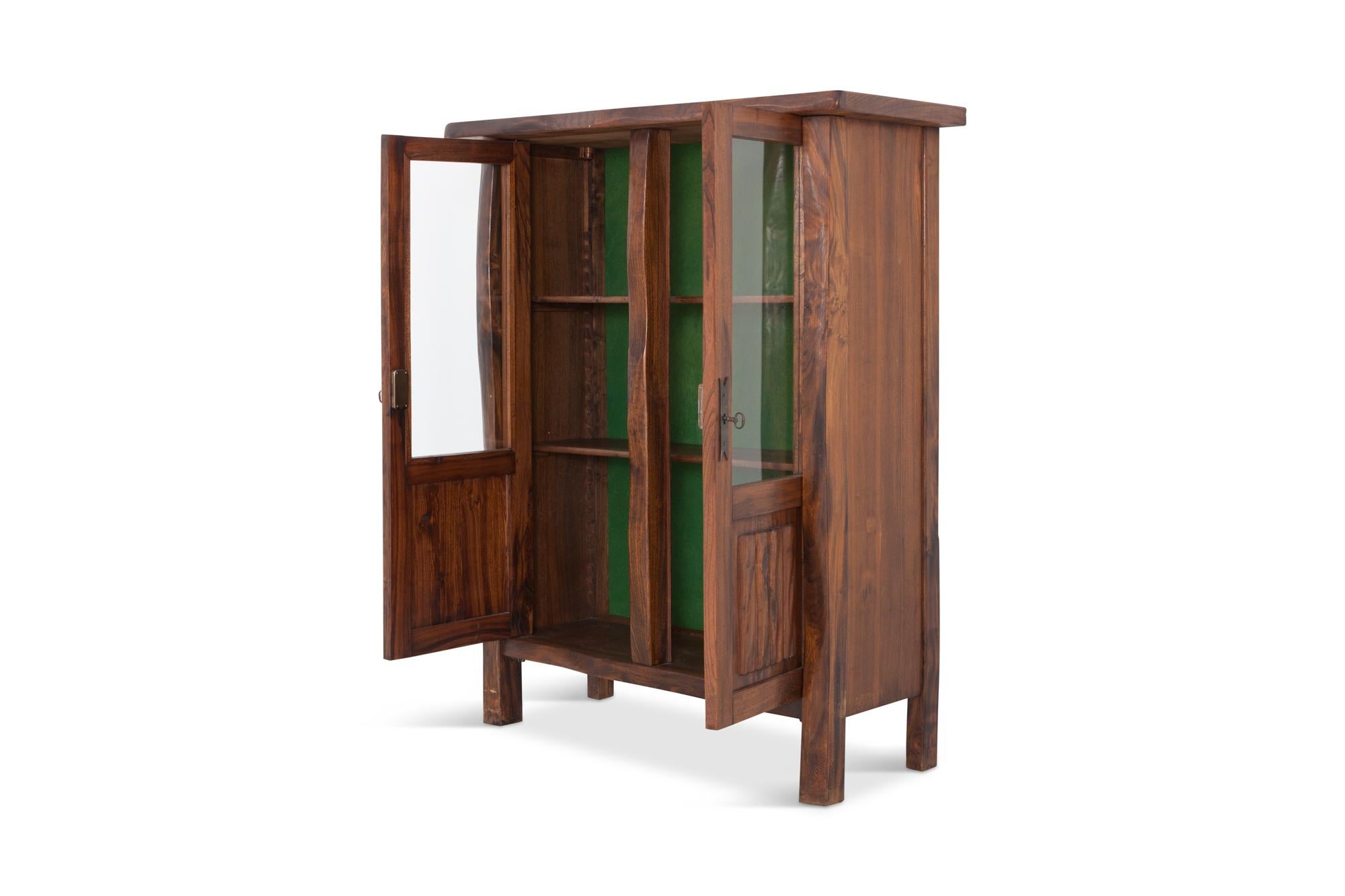 Rustic design highboard in solid elm 
The elm show a rich grain which gives this item tons of character. The two door panels are provided with glass window, therefore it can also be used as show case or dry bar. Both doors are finished with