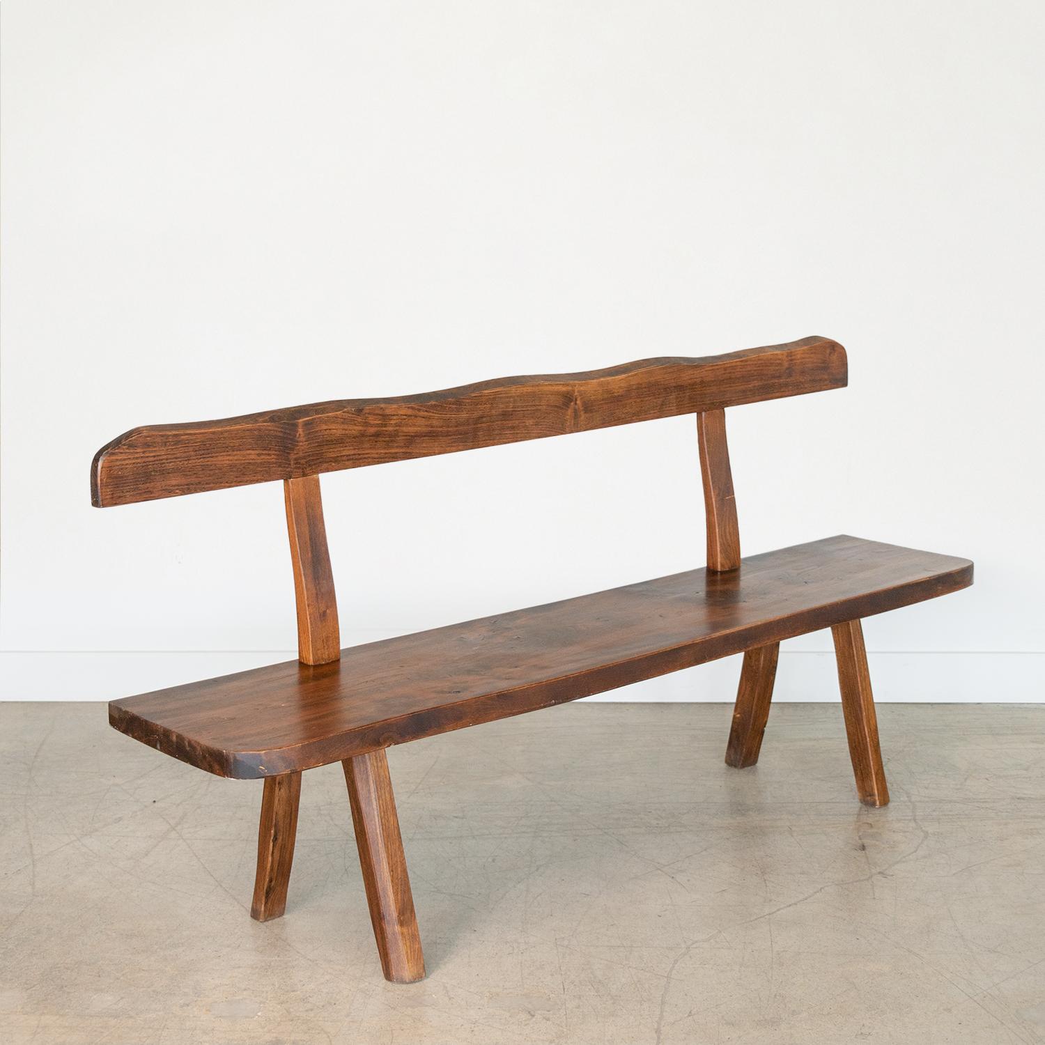 Beautiful elm wood bench by Olavi Hanninen, 1950s. Amazing T-bench Brutalist design with thick wood seat, beautiful slightly wavy wood beam back and chunky angled legs. Original wood finish showing nice age and patina.