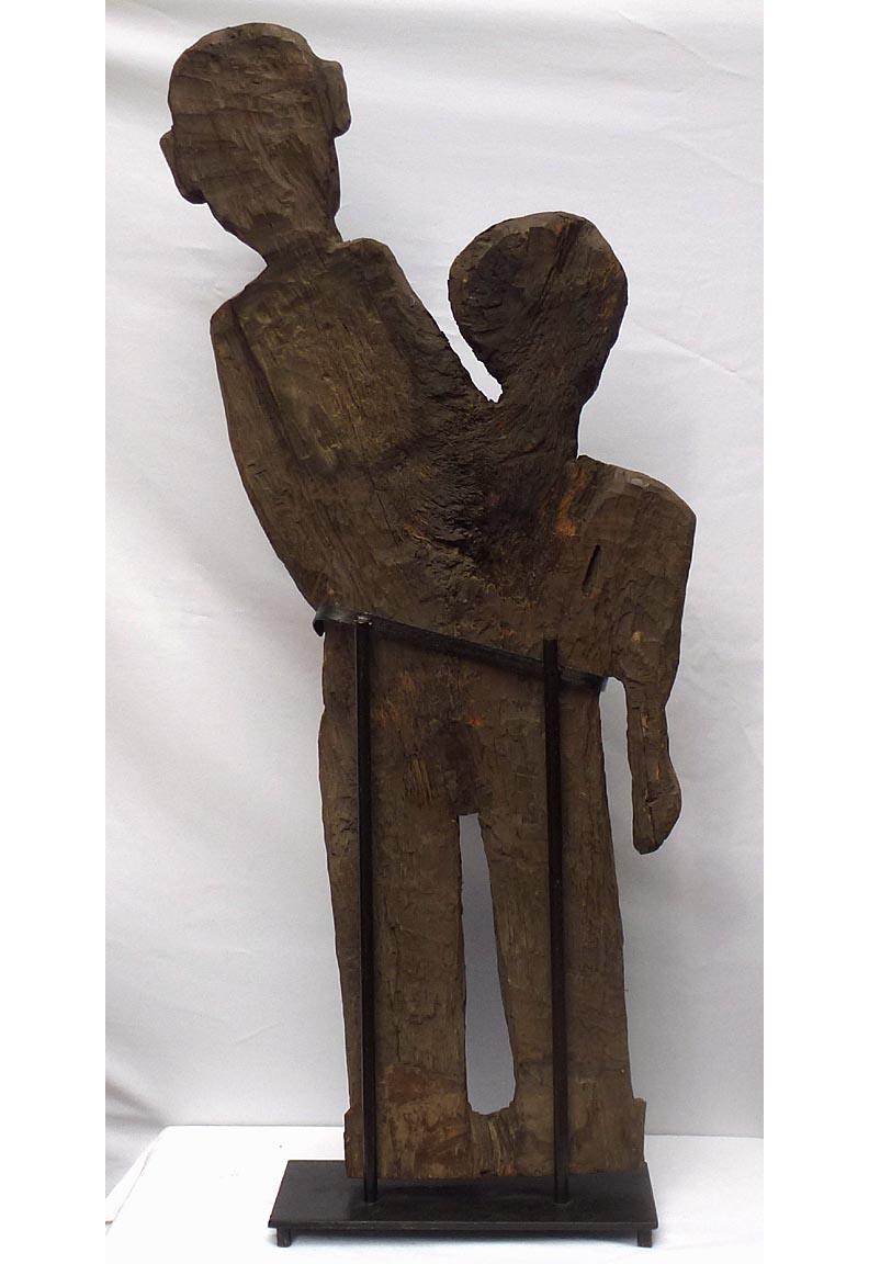 Folk Art Old 4 foot high naive and stylized carving of two people from 1 slab of wood For Sale