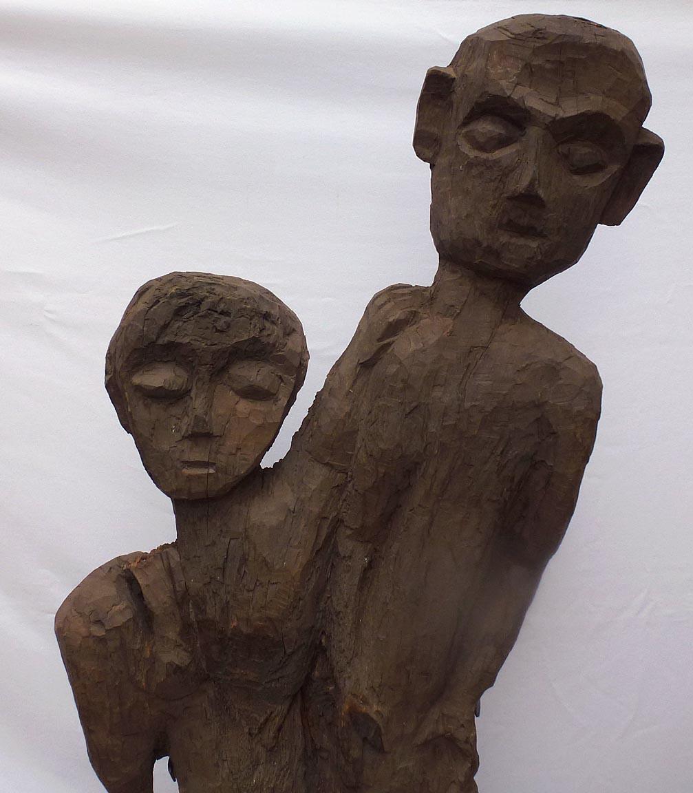 American Old 4 foot high naive and stylized carving of two people from 1 slab of wood For Sale
