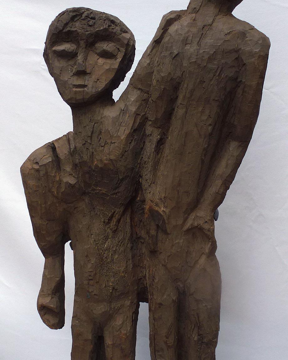 Mid-20th Century Old 4 foot high naive and stylized carving of two people from 1 slab of wood For Sale