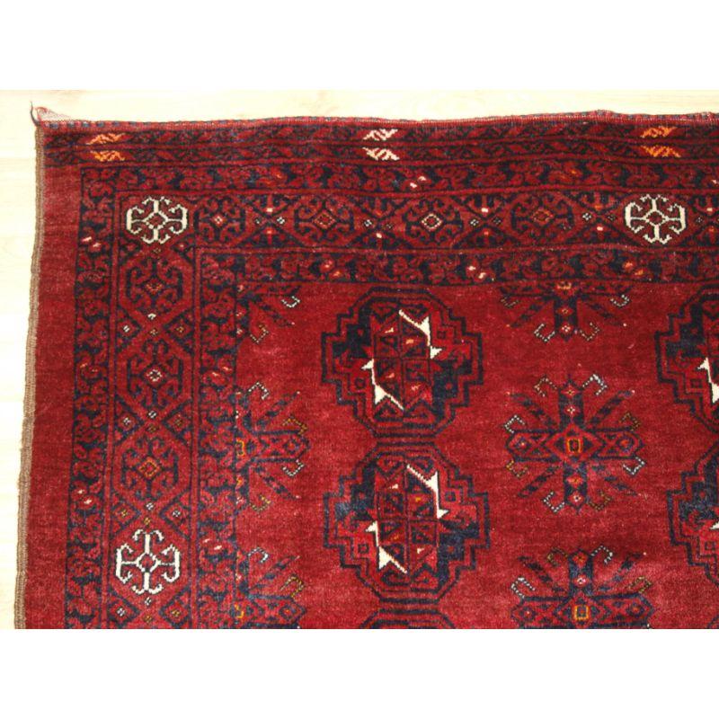 Old Afghan Ersari Turkmen 9 gul chuval of large size, with clear red colour. The elem design is a stylised tree design.

Slight even wear with good pile. This is a very tough and hard wearing rug suitable for heavy domestic use.

Hand washed and
