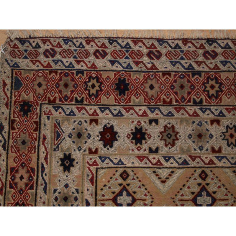 Afghan Mushwani Baluch sofreh (eating cloth) these were placed on the ground for food to be served on.

This example is woven with a mixture of Soumak weave and piled decoration. The Sofreh has very soft faded colours. 

This rug is in excellent