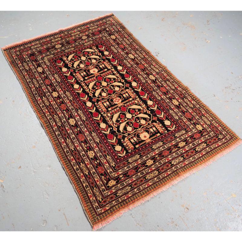 Old Afghan rug from the Herat region of North Western Afghanistan.

This is an interesting and scarce rug, the design is based on the poppy plant showing both flowering plants and seed heads. The poppy seed head is used in the production of opium