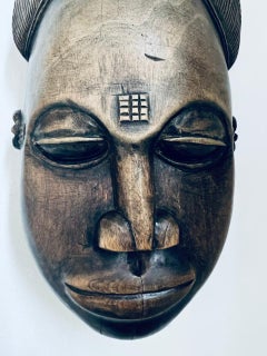 Old African mask in hand carved noble wood circa 1900