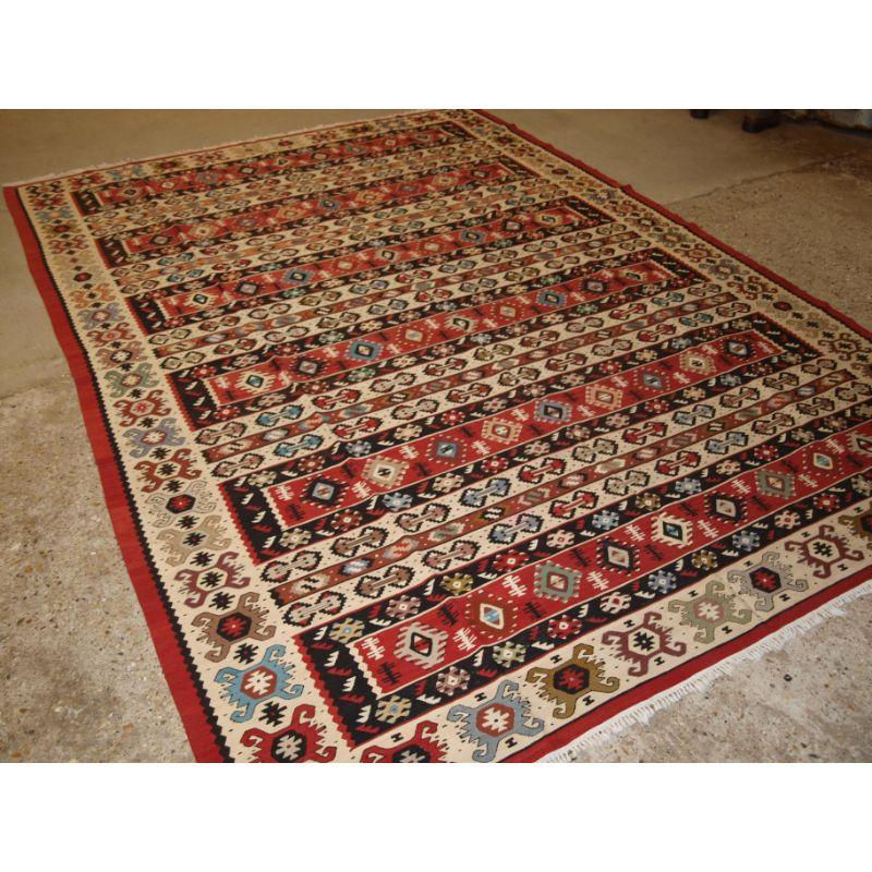 Old Anatolian Sharkoy kilim, Western Turkey of traditional banded design. A kilim of good room size.

Sharkoy kilims are also known as Sarkoy or Thracian, they originate from Western Turkey or the region known as European Turkey or The Balkans.

The