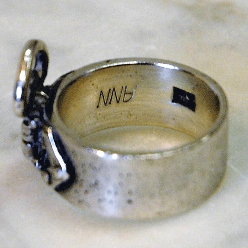Old and beautiful heart silver ring with nice ornaments from 1923, Sweden. Marked KM 925 V7. Inscription ANN. Inner diameter is 16 mm, height of ring 20 mm. Length of heart 15 mm. Width of ring 8 mm. Weight 7 gram. Condition as in the pictures